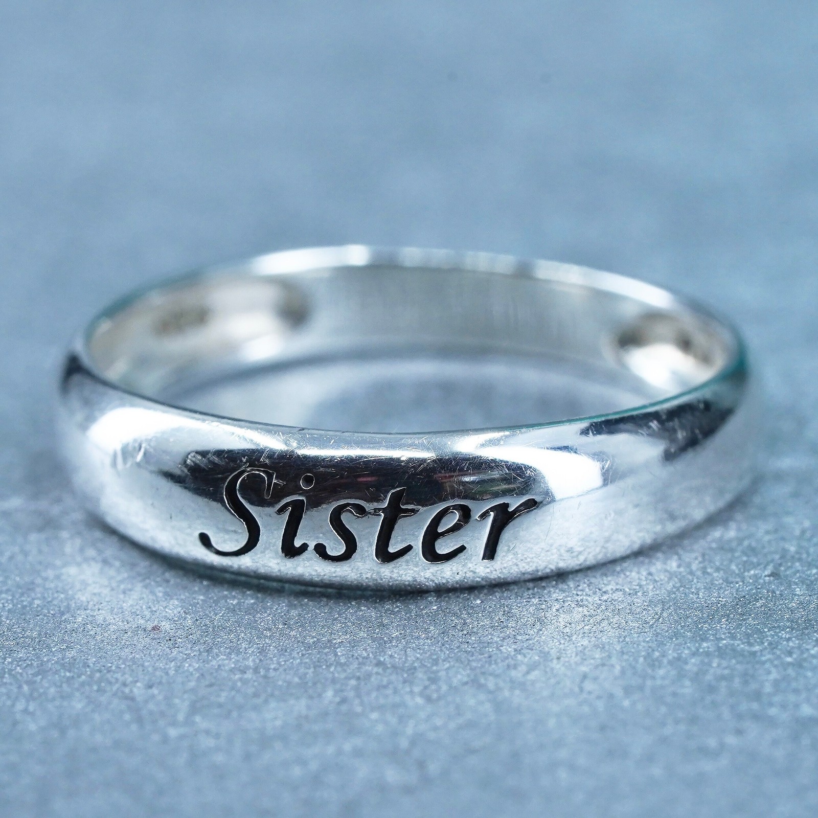 Size 7, vintage southwestern Sterling 925 silver ring, band embossed “sister”