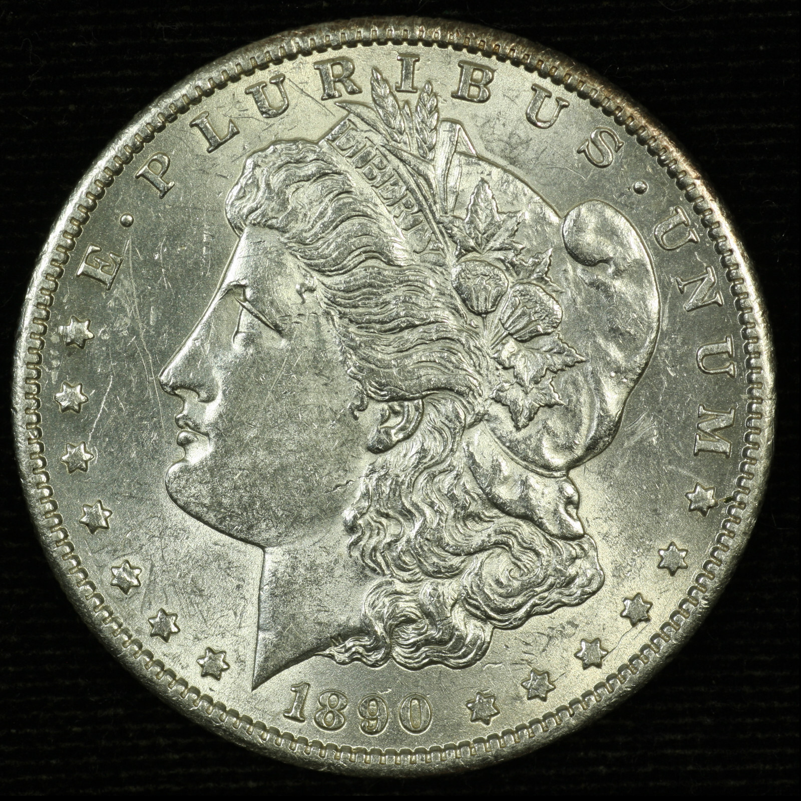 Morgan Silver Dollar. 1890 S. About Uncirculated. Lot # 9049-120-100