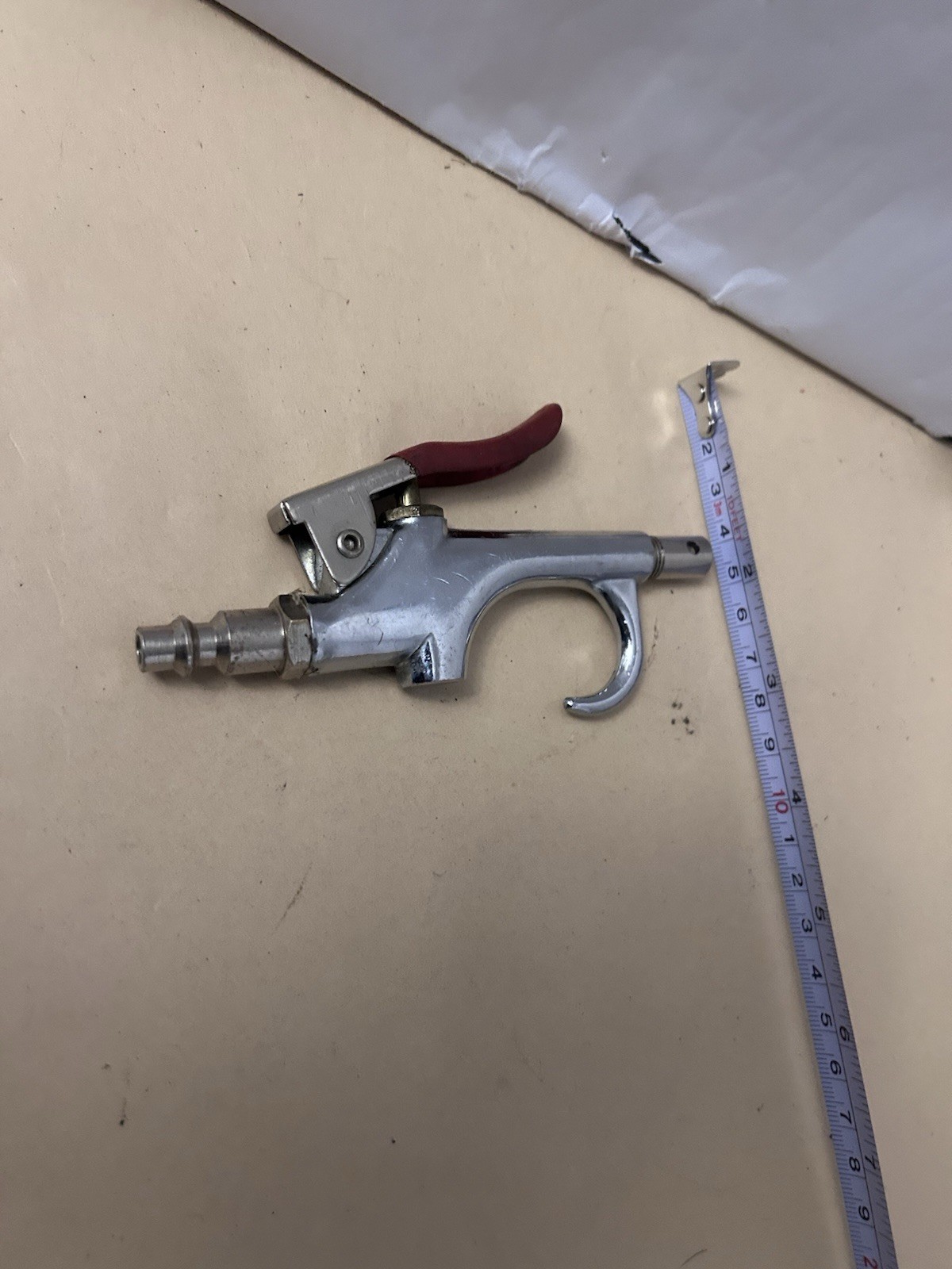 Unbranded untested pneumatic air gun with red handle
