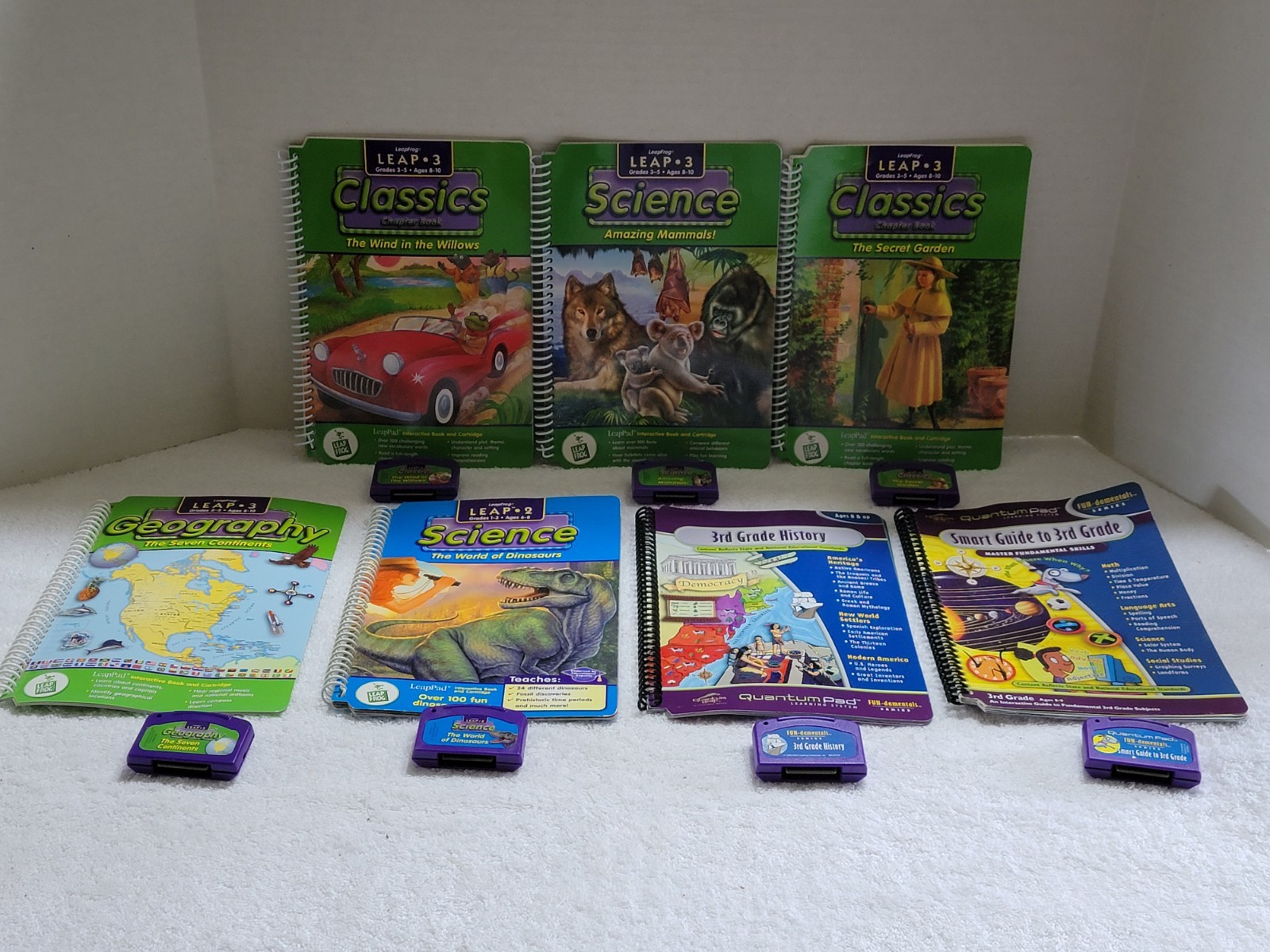 LOT OF 7 LEAP PAD LEAP FROG BOOKS & CARTRIDGES ASSORTED SUBJECTS & ACTIVITIES