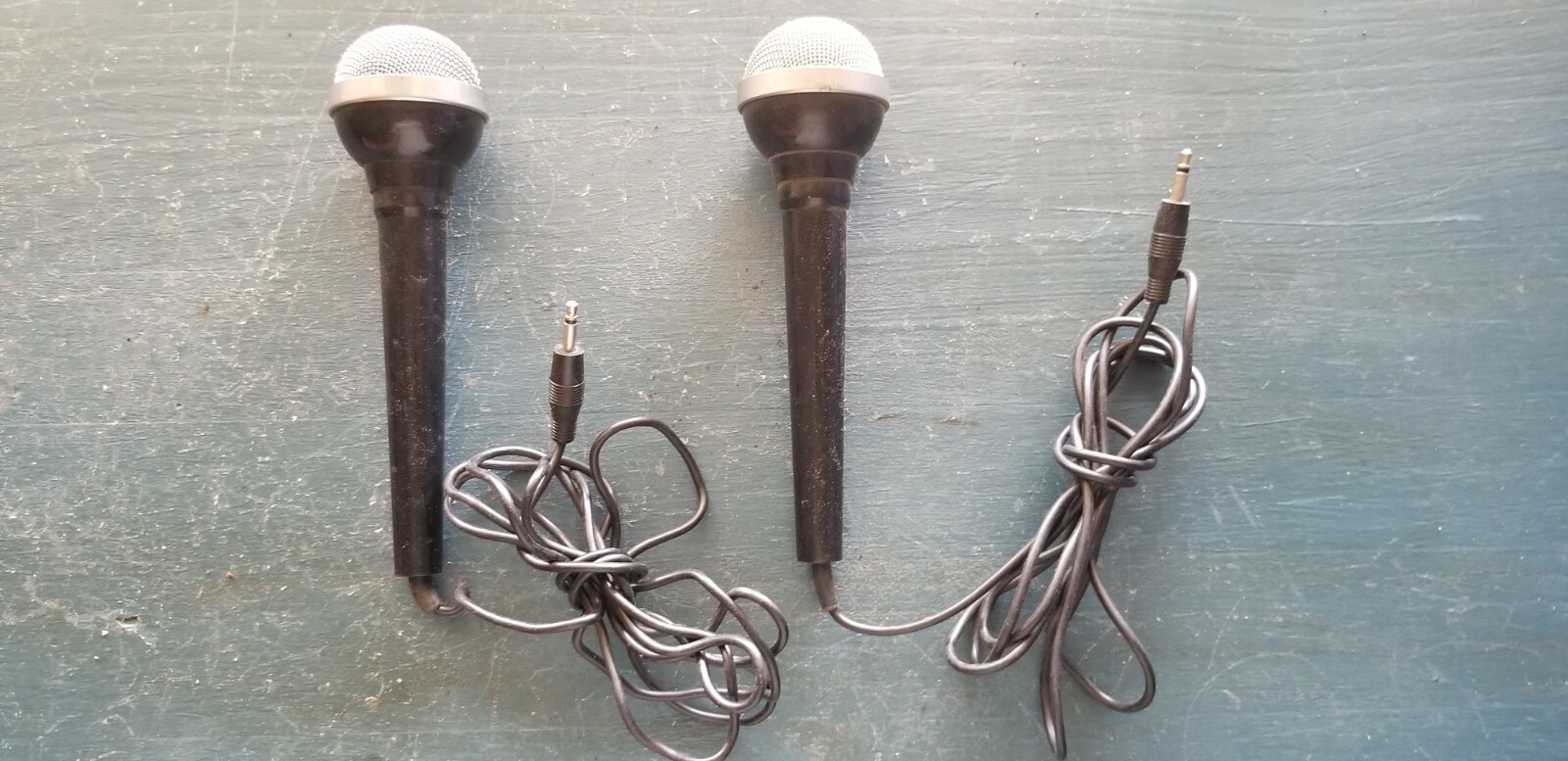 Two vintage wired microphones with metal/chrome/mesh tip