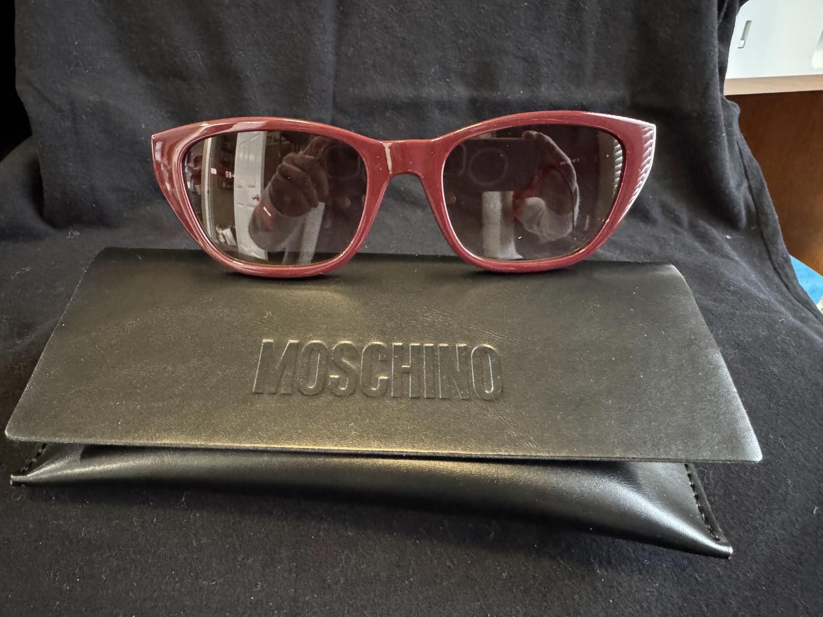 Moschino Burgundy Cat Eye Sunglasses with Gold Buckle Detail
