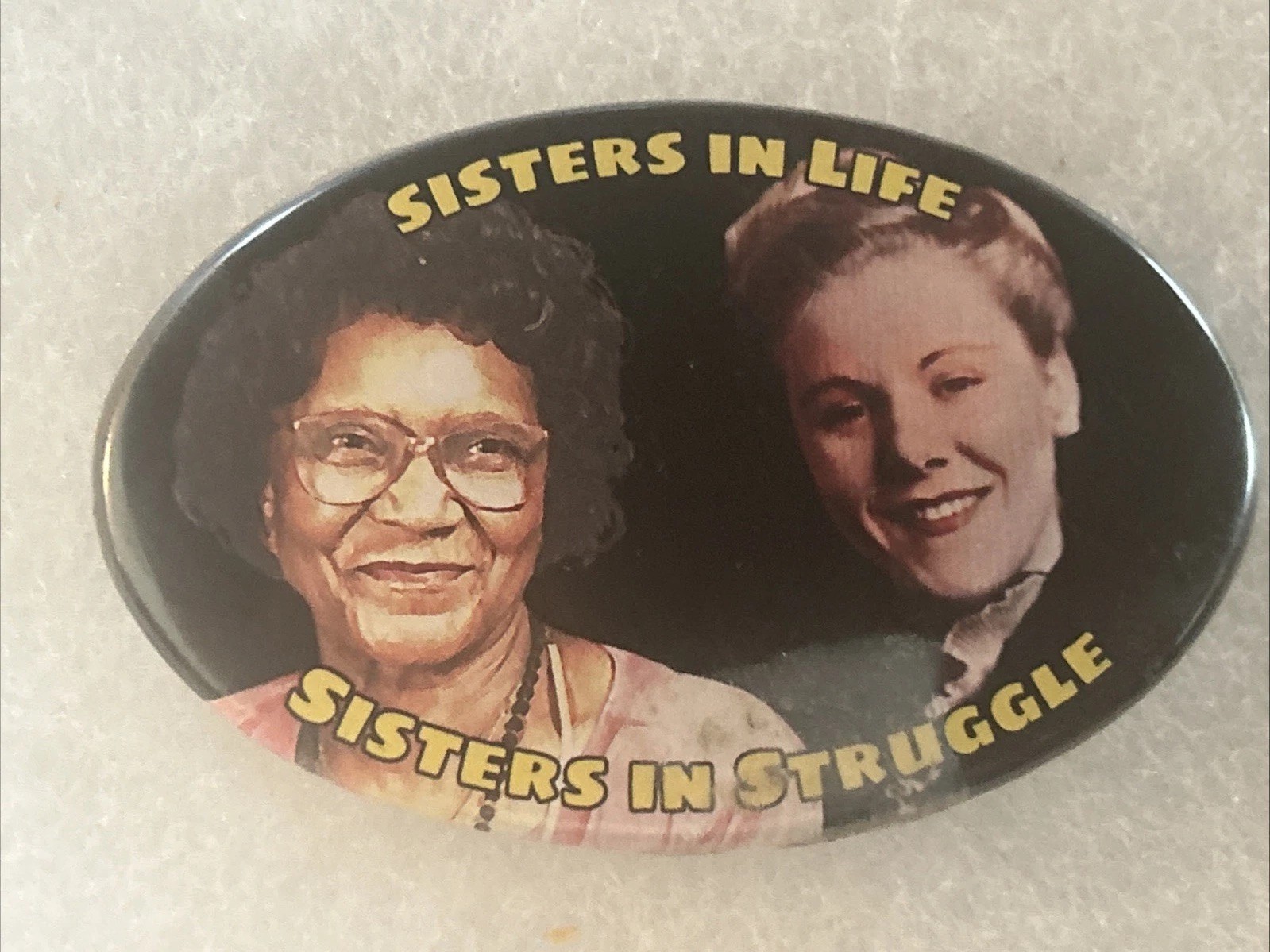 Off Broadway Liberation Sisters In Life Sister In Struggle oval pinback button