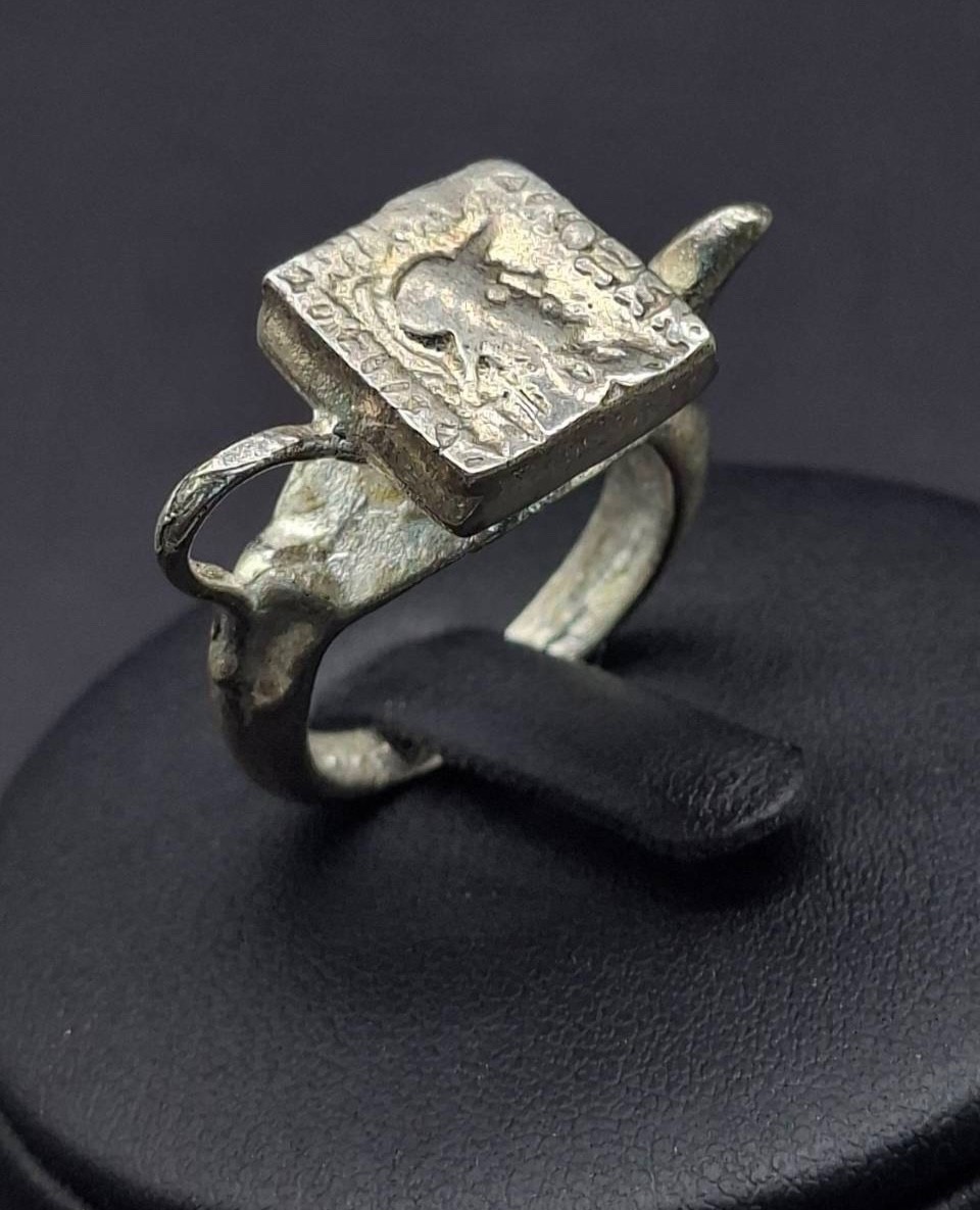 vintage-style ring featuring a square, textured face plate Roman Greco coin