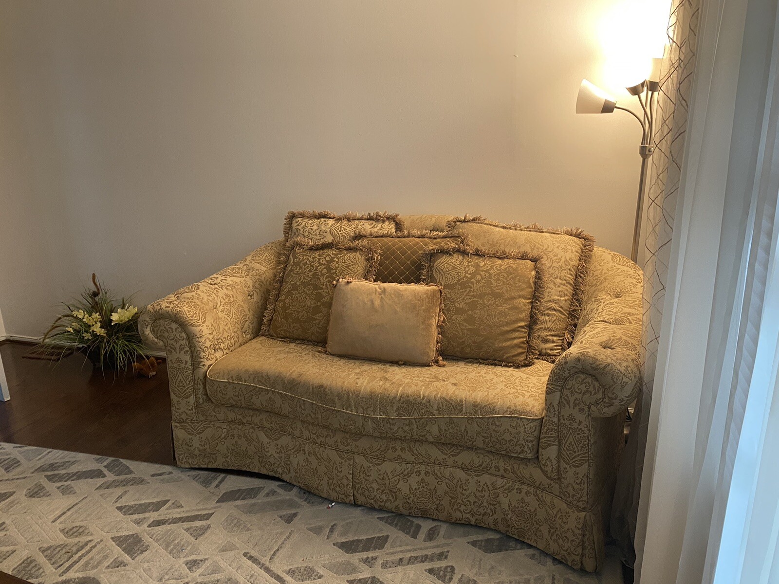 A Set Of Beige Sofas And A Coffee Table