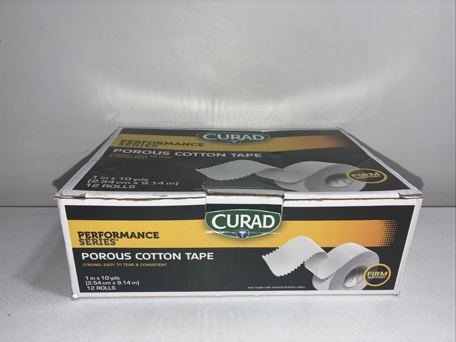 New Curad Porous Cotton Tape/ Box Of 12 Rolls/ 1x10yards/Damaged Box
