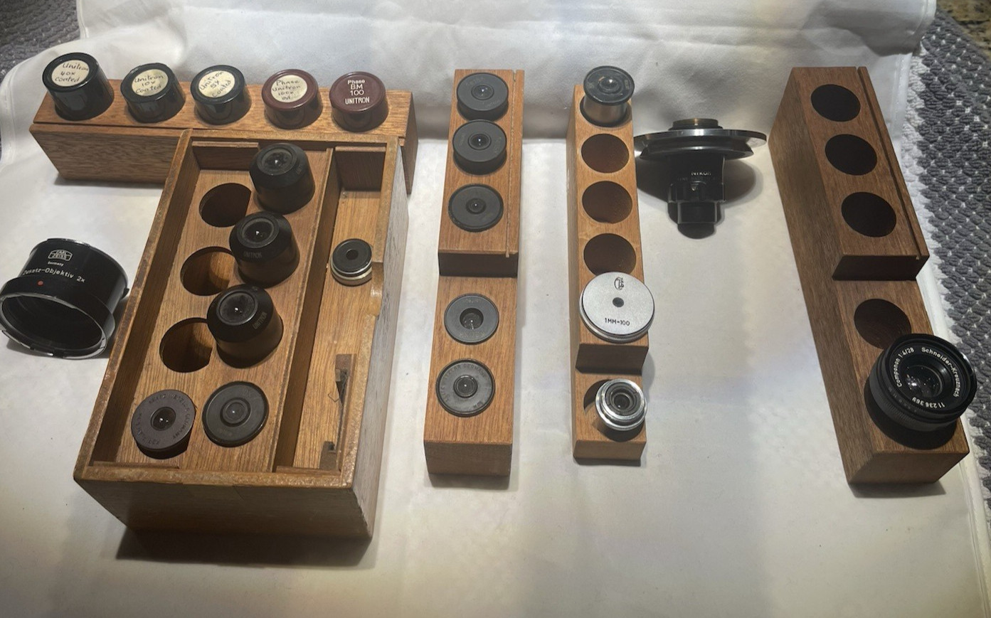 Twenty Two Vintage Microscope Lens, Ocular and Five Wooden Holder Collection