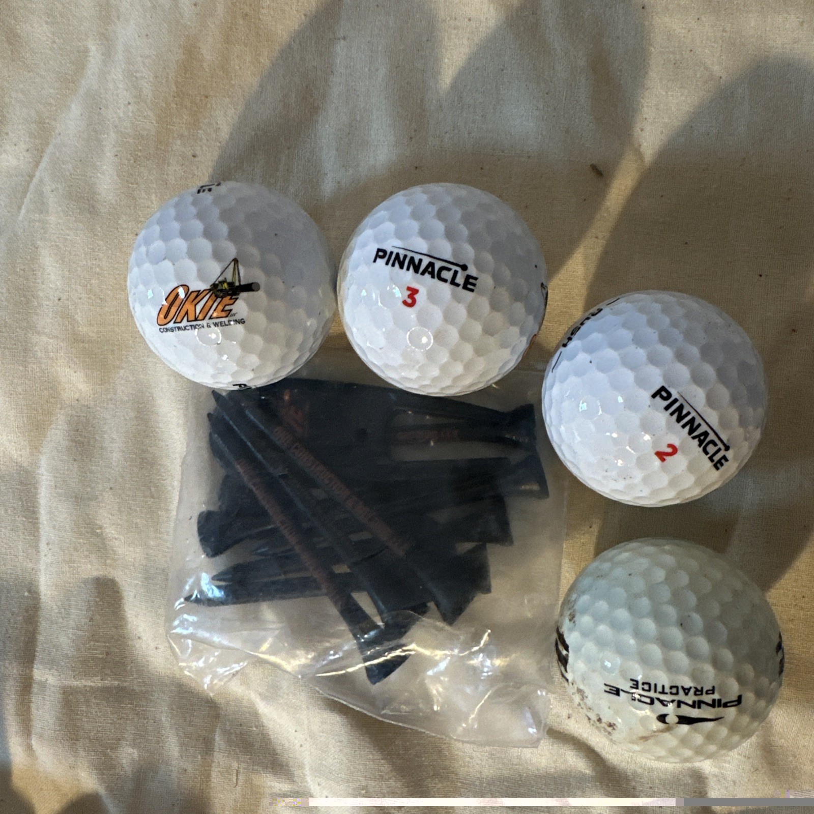 Pinnacle Lot Of 4 Golf Balls W/Logo Okie Constr & Welding Practice Tees Merch