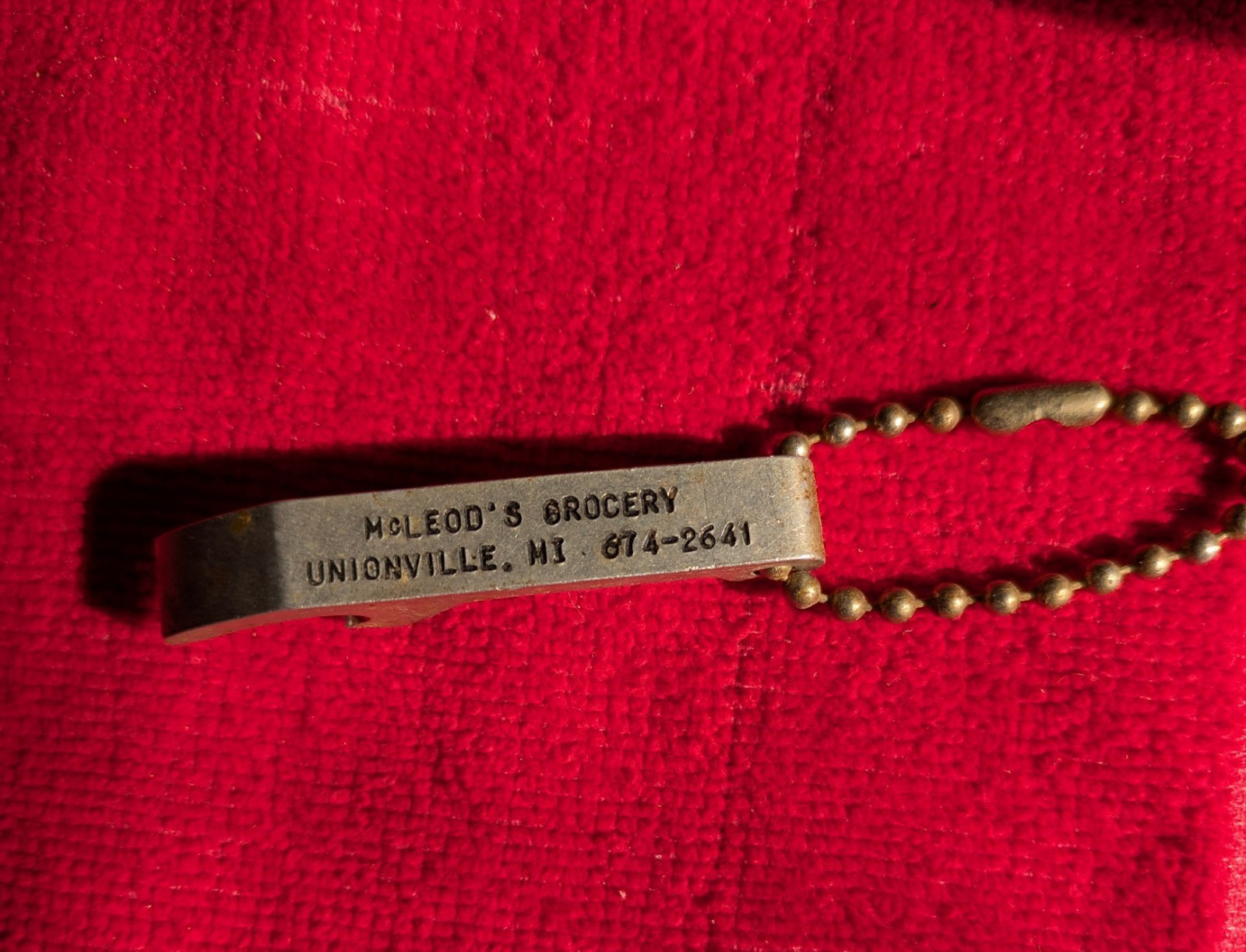Vintage McLeod's Grocery bottle opener, Unionville, MI
