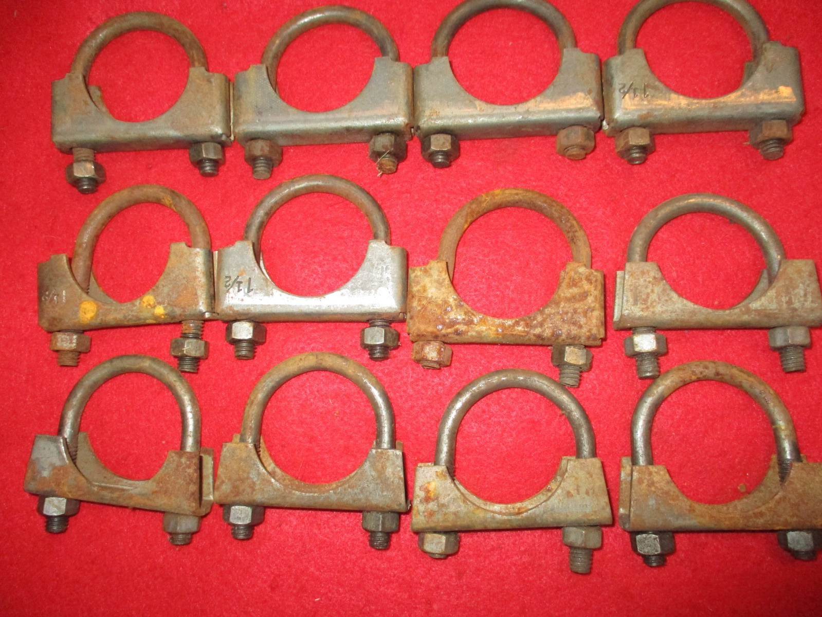 Twelve 1 1/2" muffler clamps.