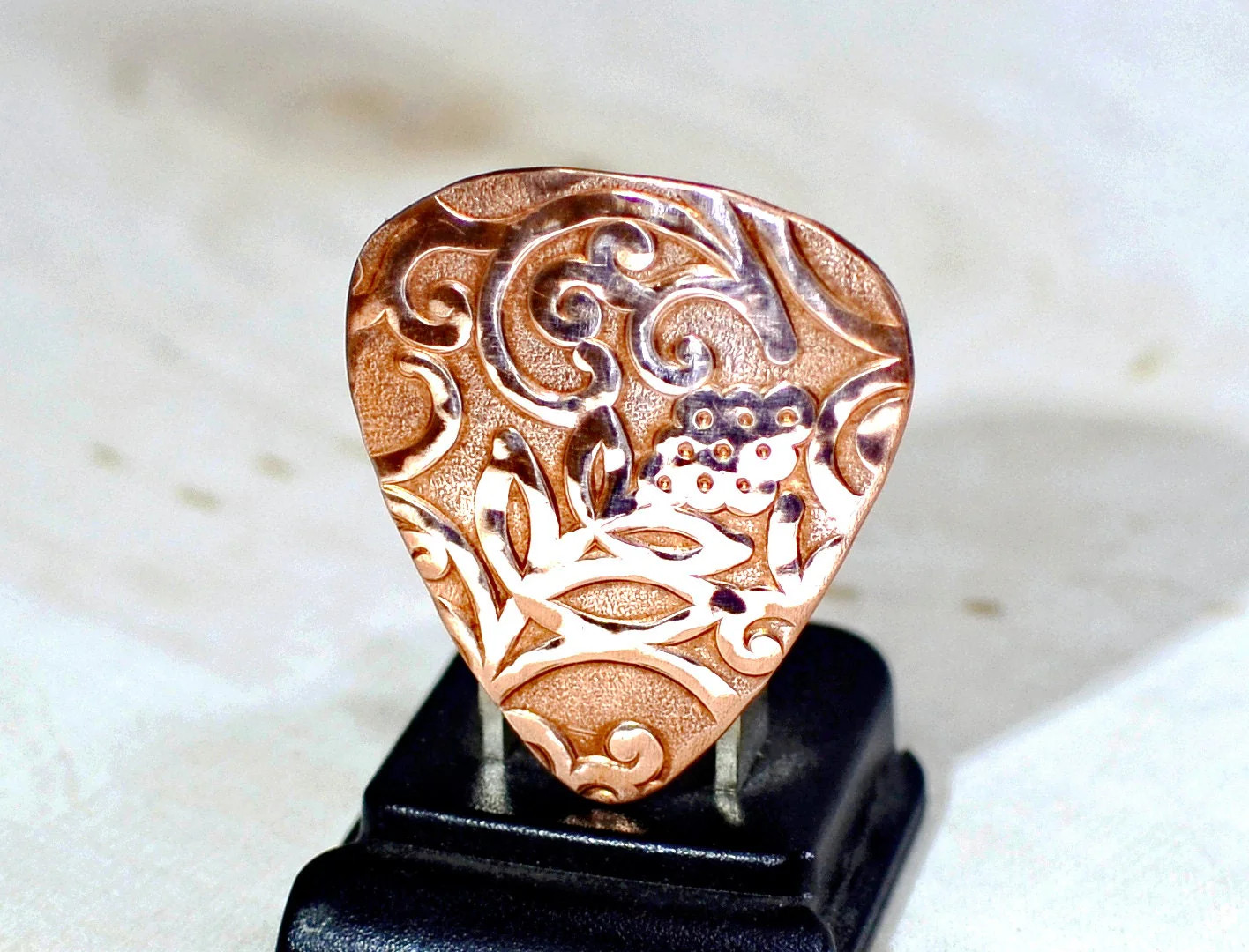 Rococo copper guitar pick with vines