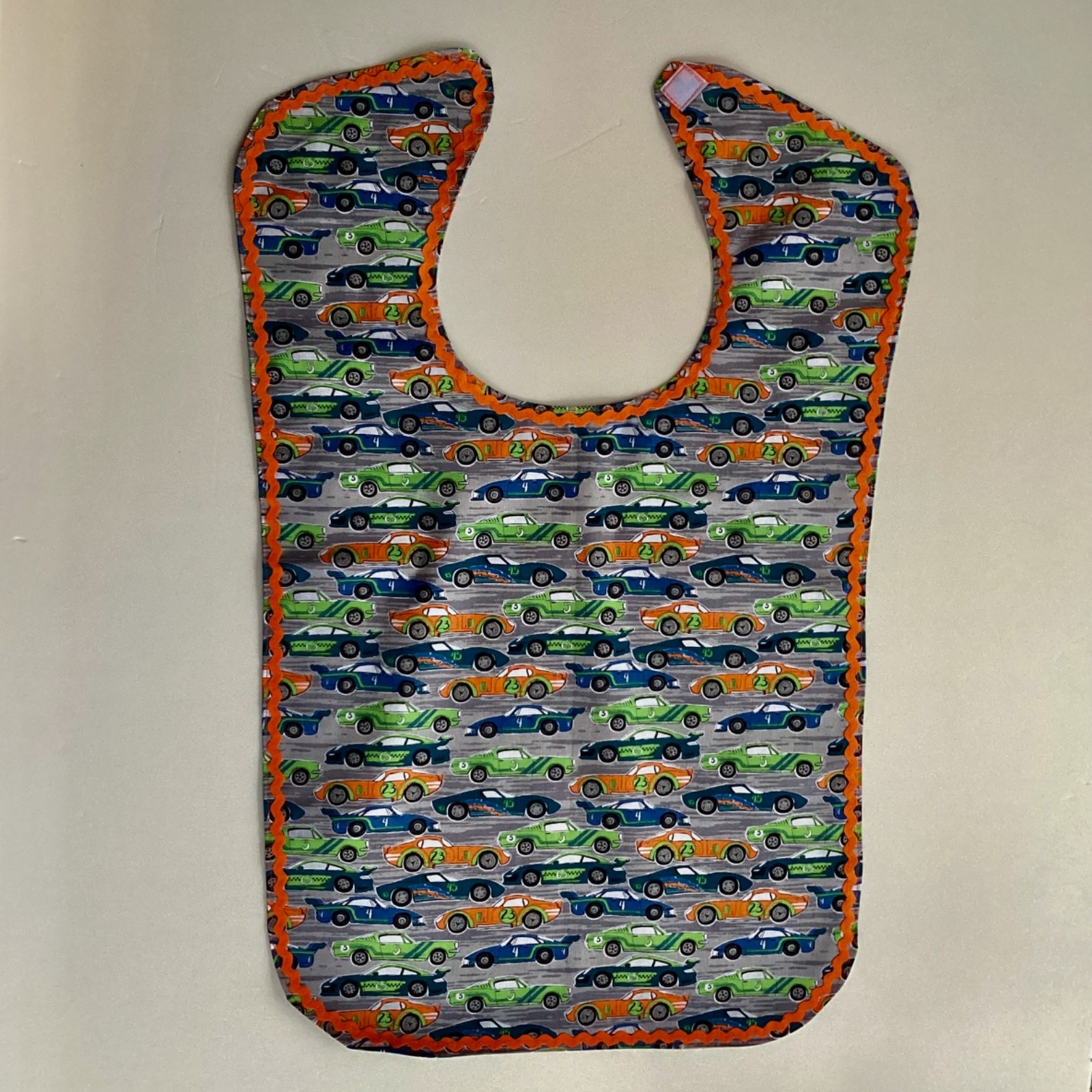 ADULT CLOTHING PROTECTOR/ BIB (RACING CARS)
