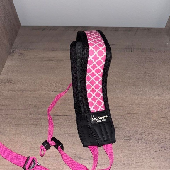 Pink and black camera strap