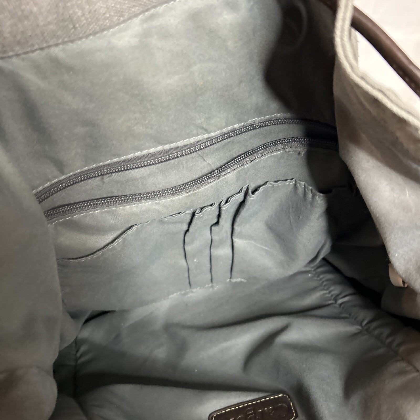 Cargoit Gray Canvas Backpack Magnetic Closures Pockets Straps and A Deep Inside