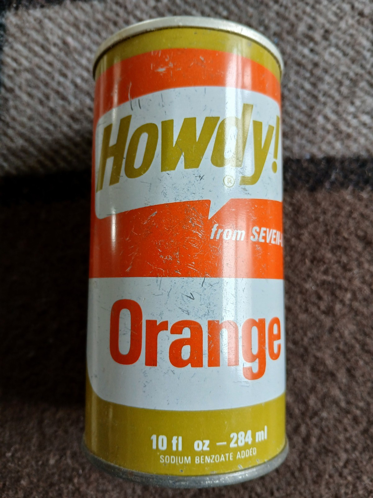 Howdy!  Orange from Seven Up pull top 10 oz soda pop can Toronto Canada