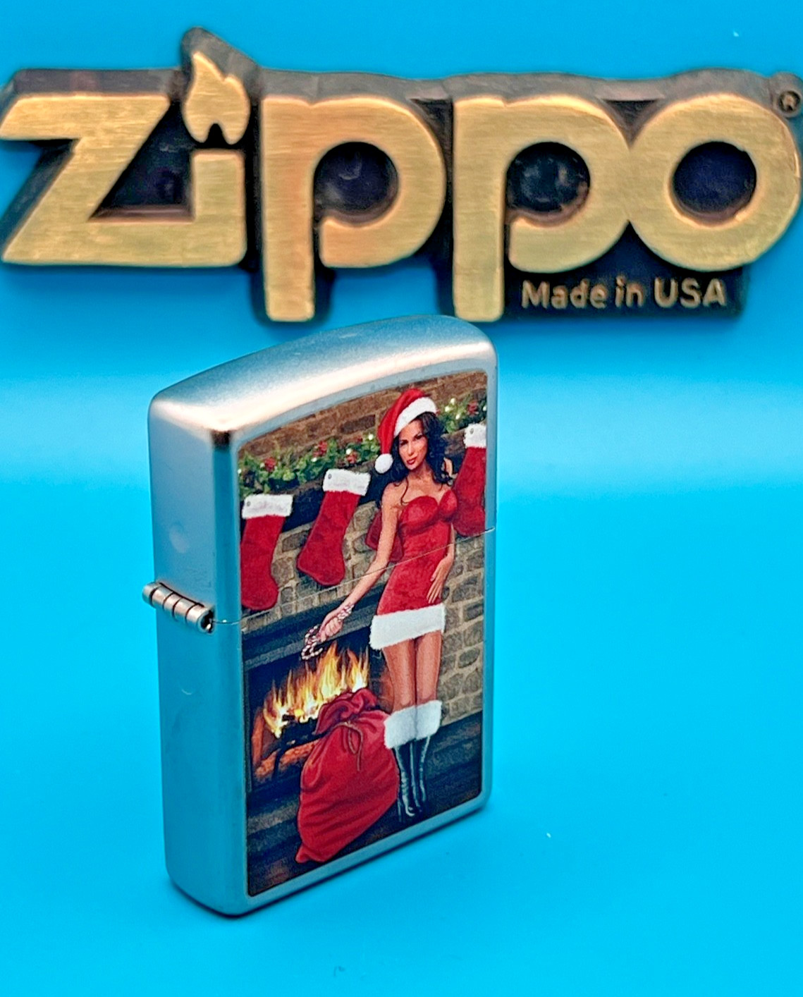 Genuine Brand New 2017 ZIPPO Lighter PULLING A CRACKER BY THE FIRE Satin Chrome