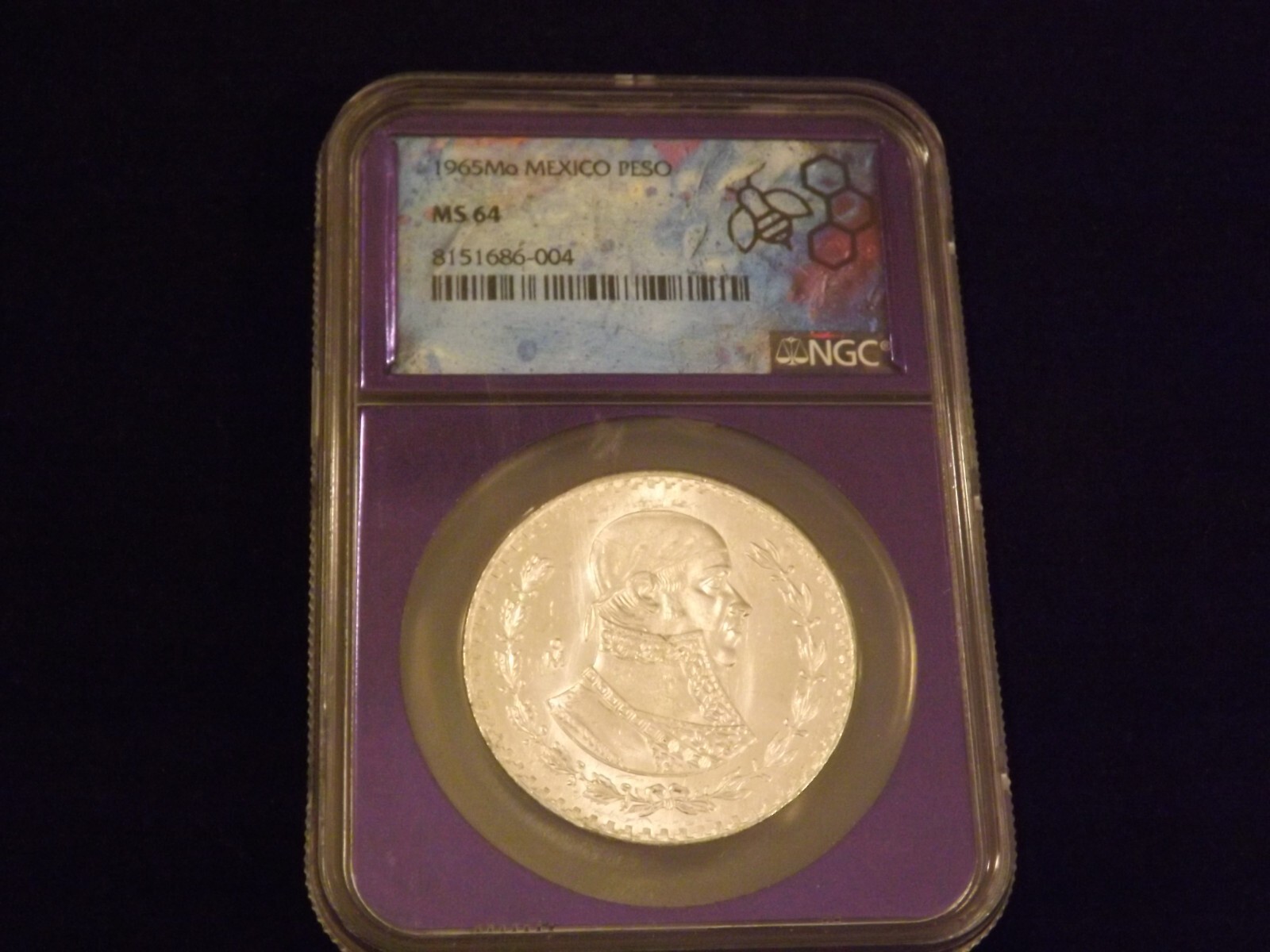 1965    Mo Peso  Purple Bee Frame Holder    NGC MS 64