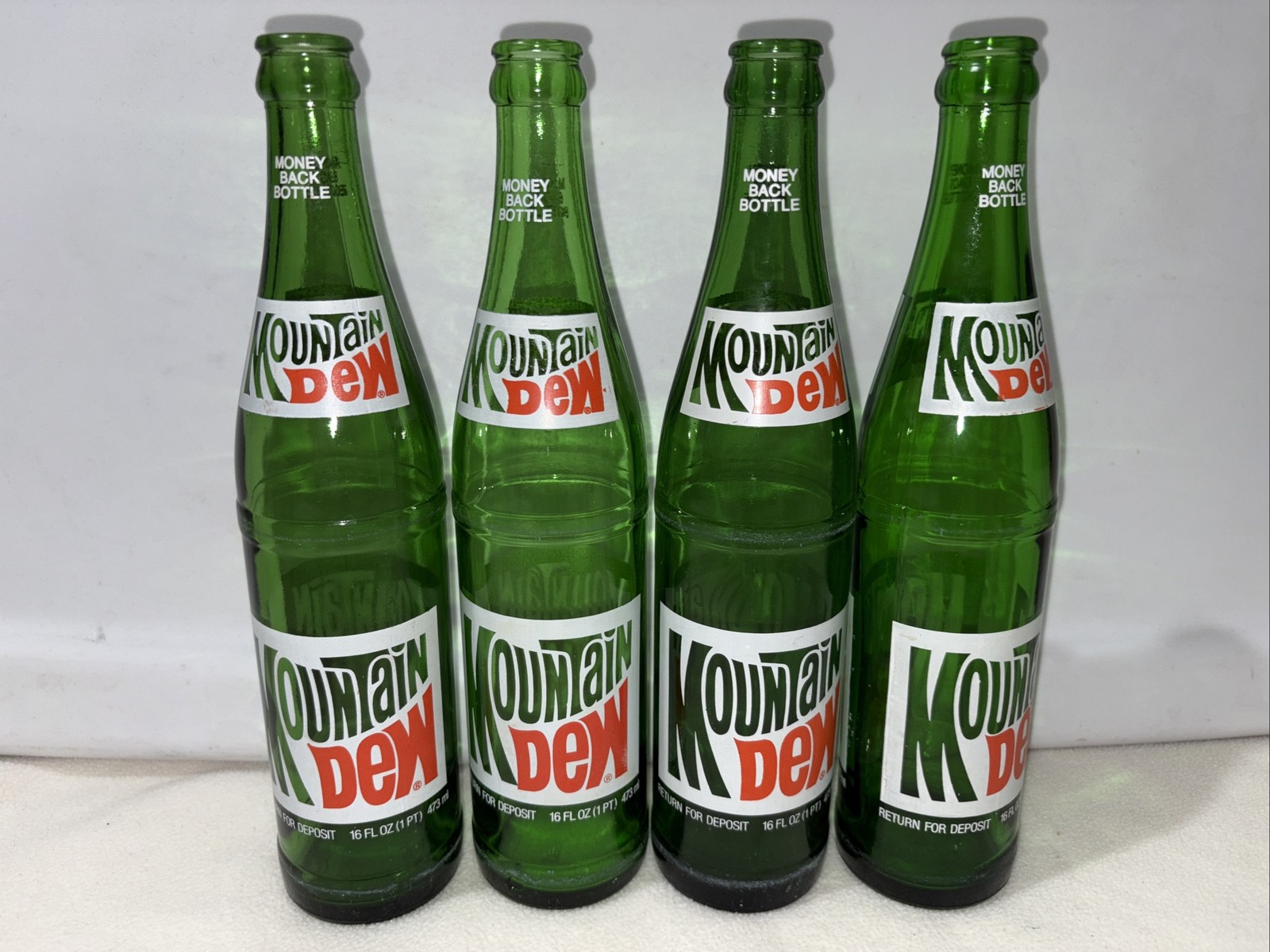 Lot of 4 Vtg 1970s 80s Mountain Dew Bottles 16 oz Green Glass Money Back Bottle