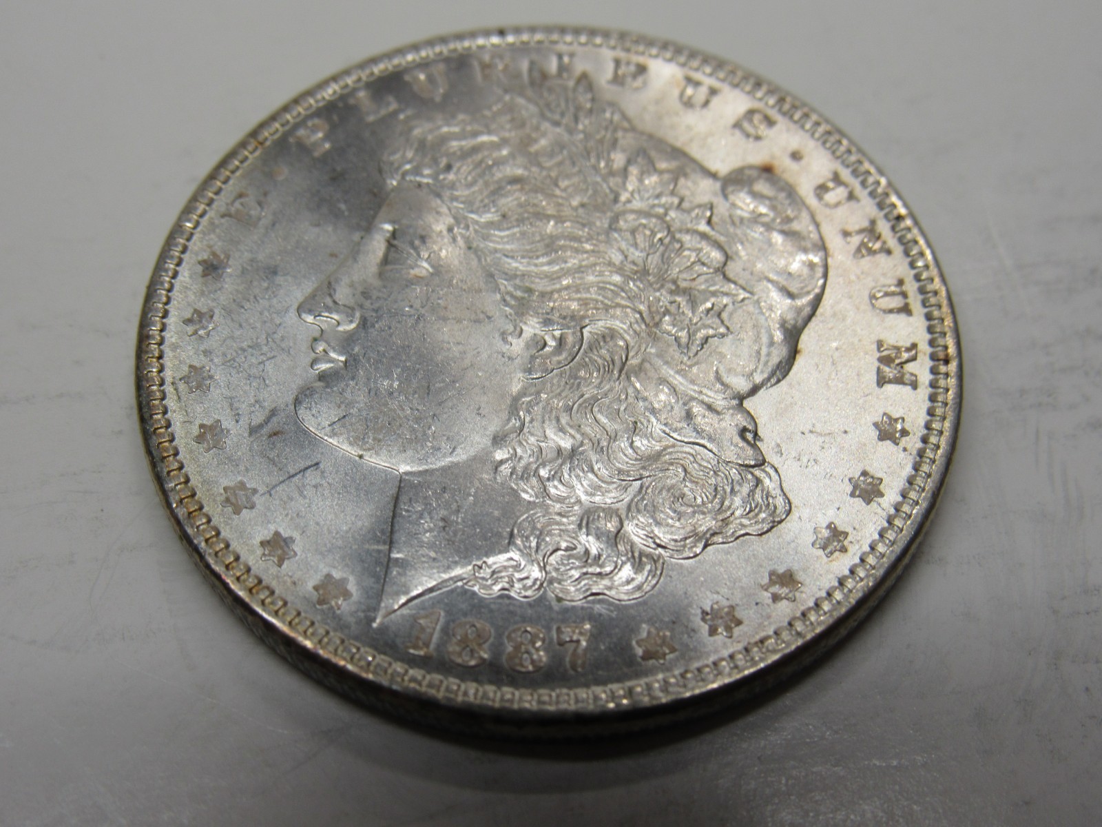 UNITED STATES 1887 MORGAN SILVER DOLLAR  AU CONDITION *