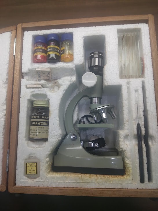 Small microscope kit with tools, slides, and case