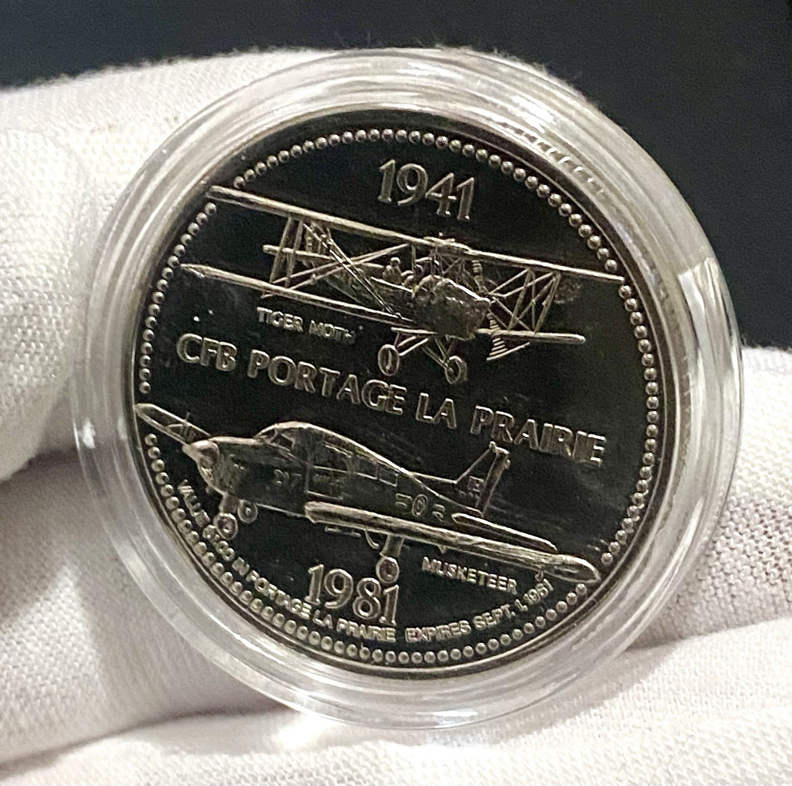 CFB Portage La Prairie 1981 Trade DOLLAR Token with RCAF Tiger Moth & Musketeer