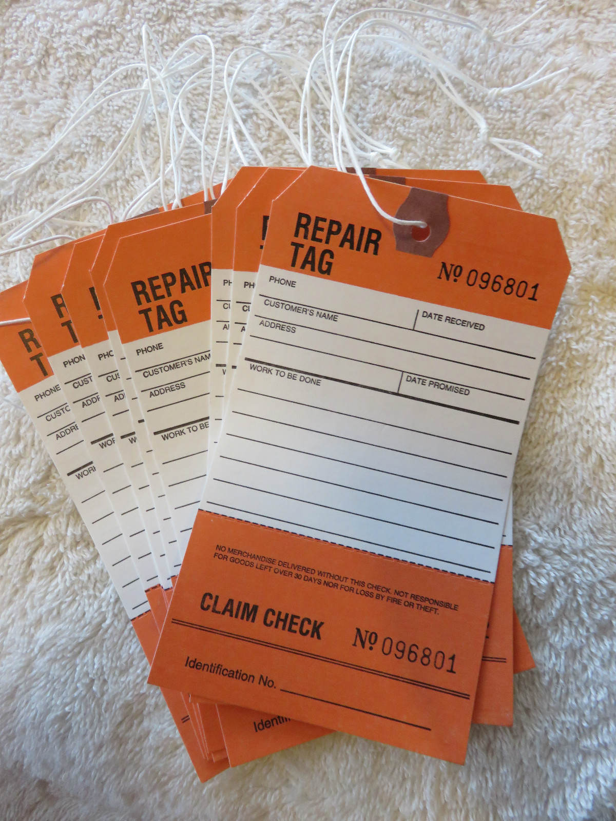 🎯🎯LOT OF 25-"CUSTOMER REPAIR TAGS" PERFORATED W/LOOP STRING.🎯🎯