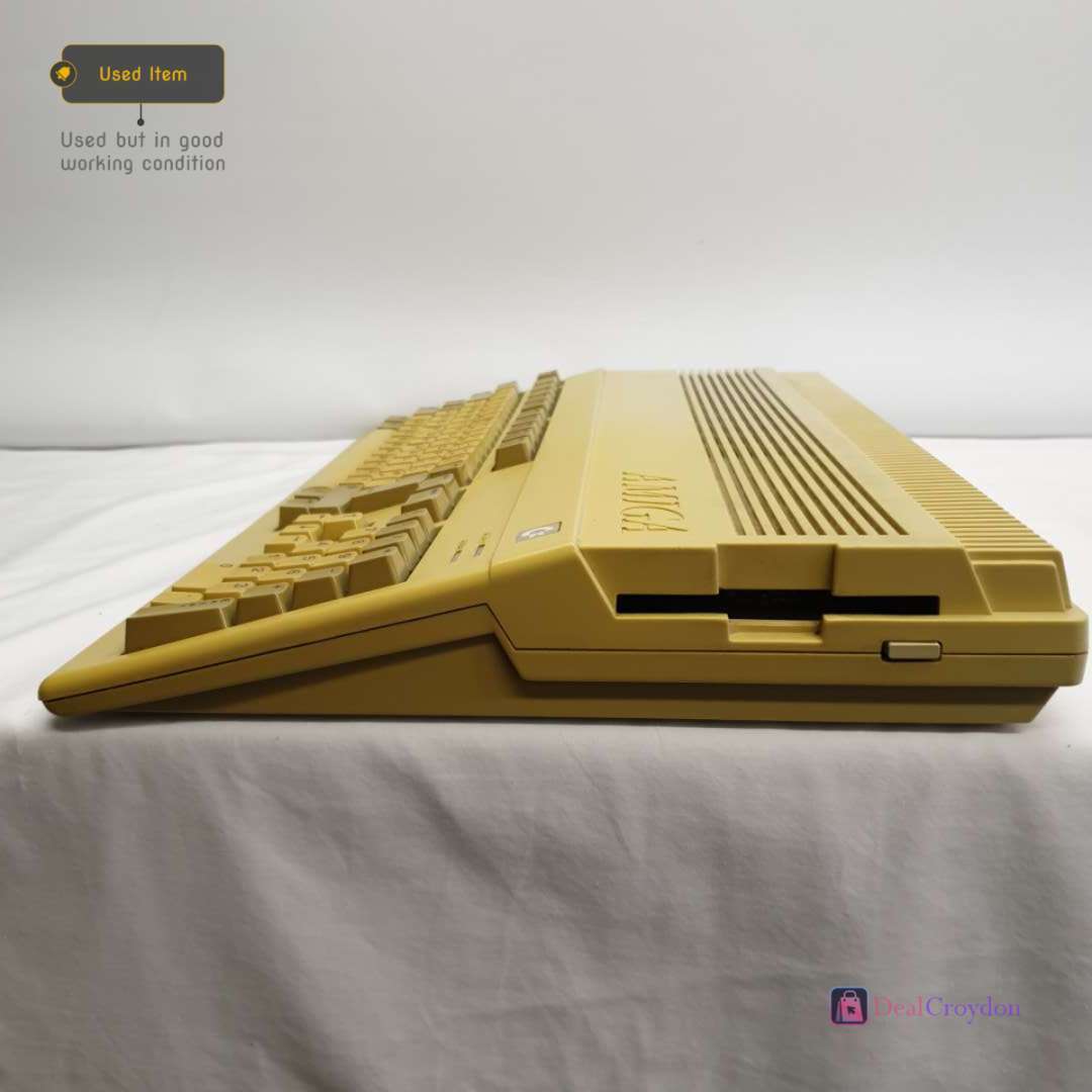 COMMODORE AMIGA A500 COMPUTER +COMMODORE A520 +MOUSE + 10 DISKS + POWER SUPPLY