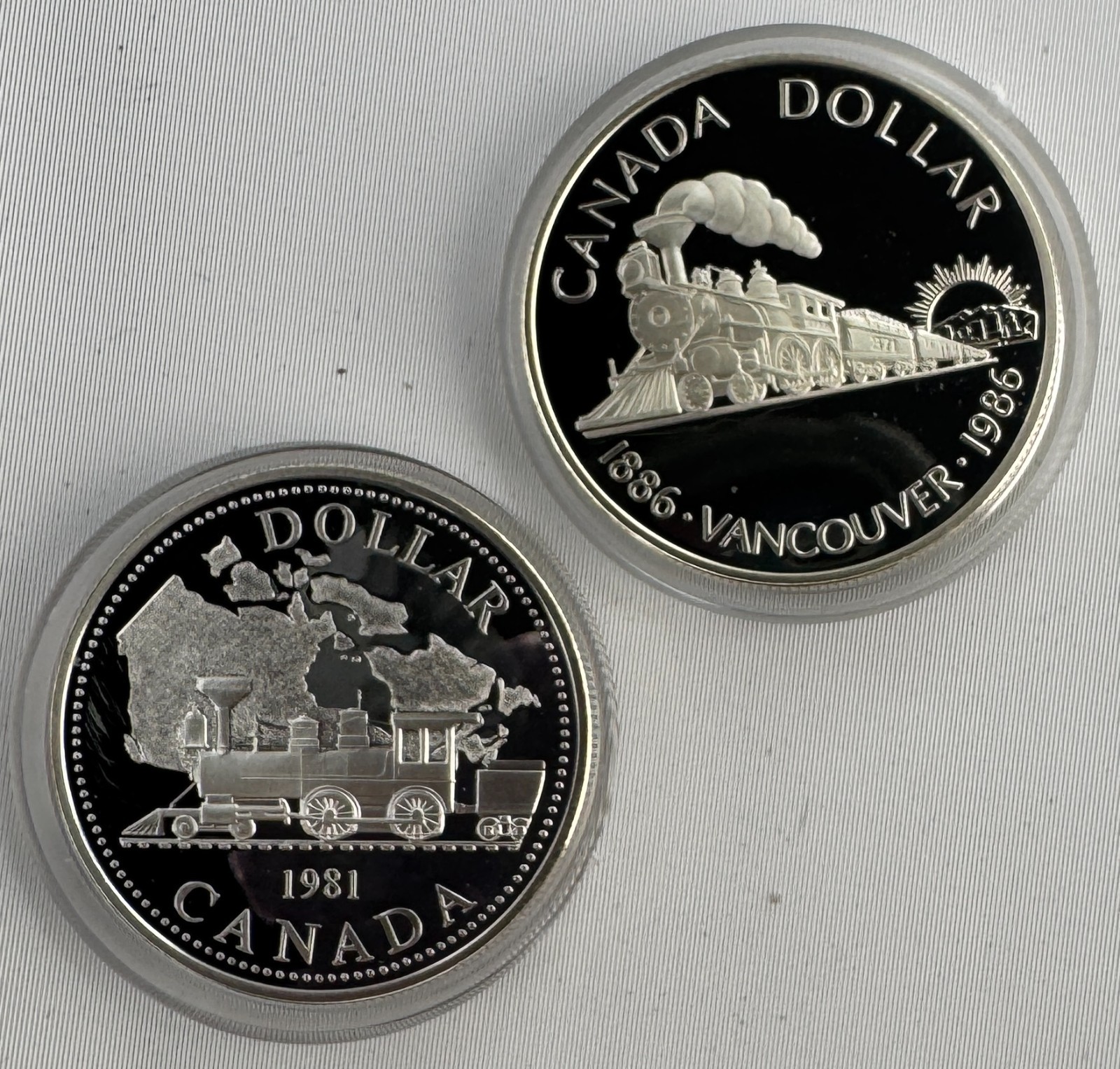 1981 + 1986 Canada Silver Dollar Proof 2-Coin Lot in Capsules RCM Train Engine
