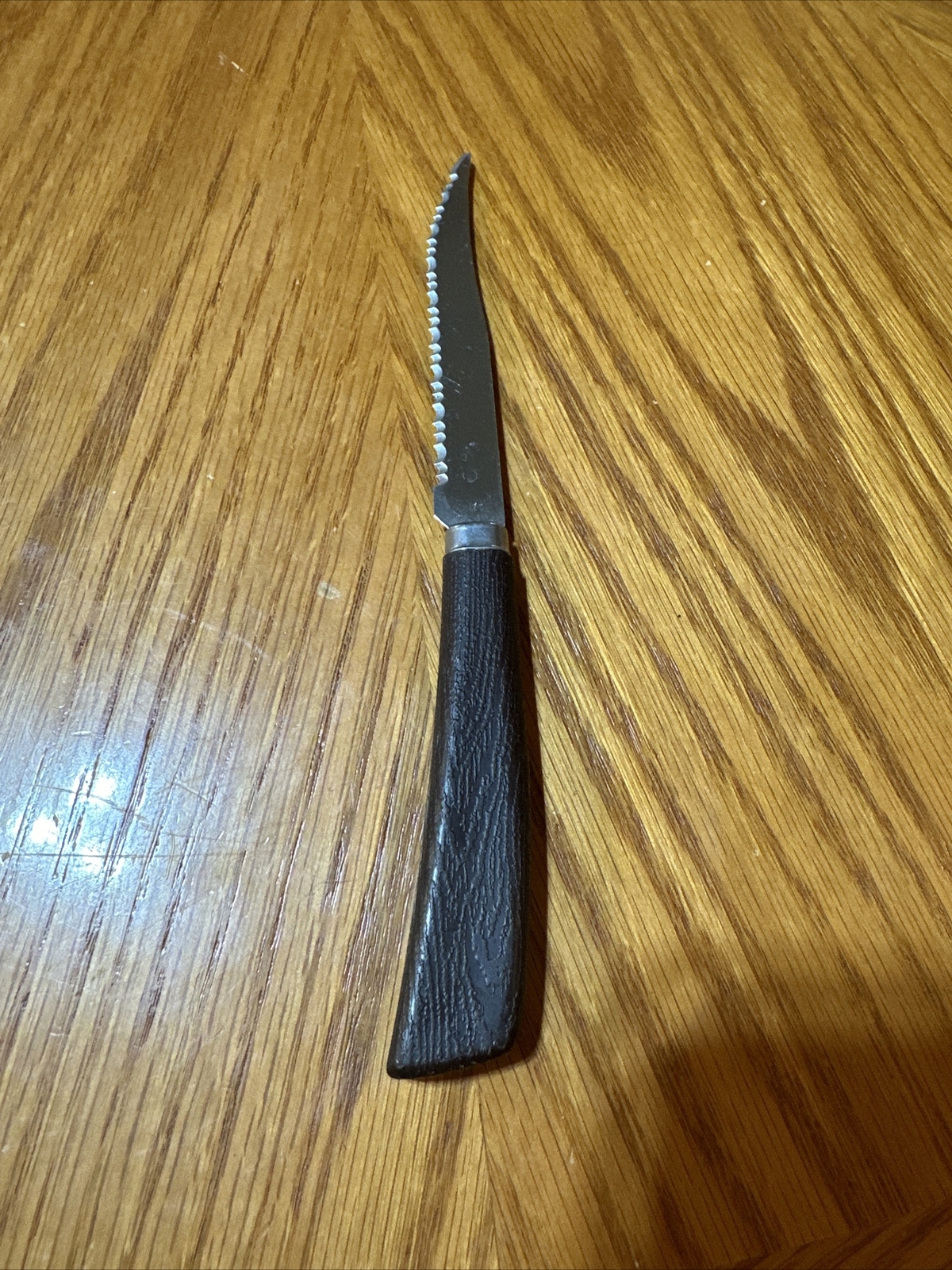 Vintage Quikut Steak Knife Brown Faux Wood Handle Serrated Made In USA