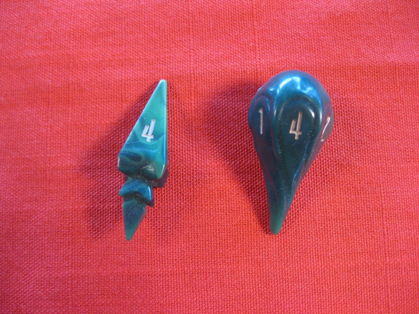 PAIR OF UNUSUAL SHAPED GAME DICE.  GREEN RESIN.  4 AND 6 SIDED 1.5 INCHES TALL.