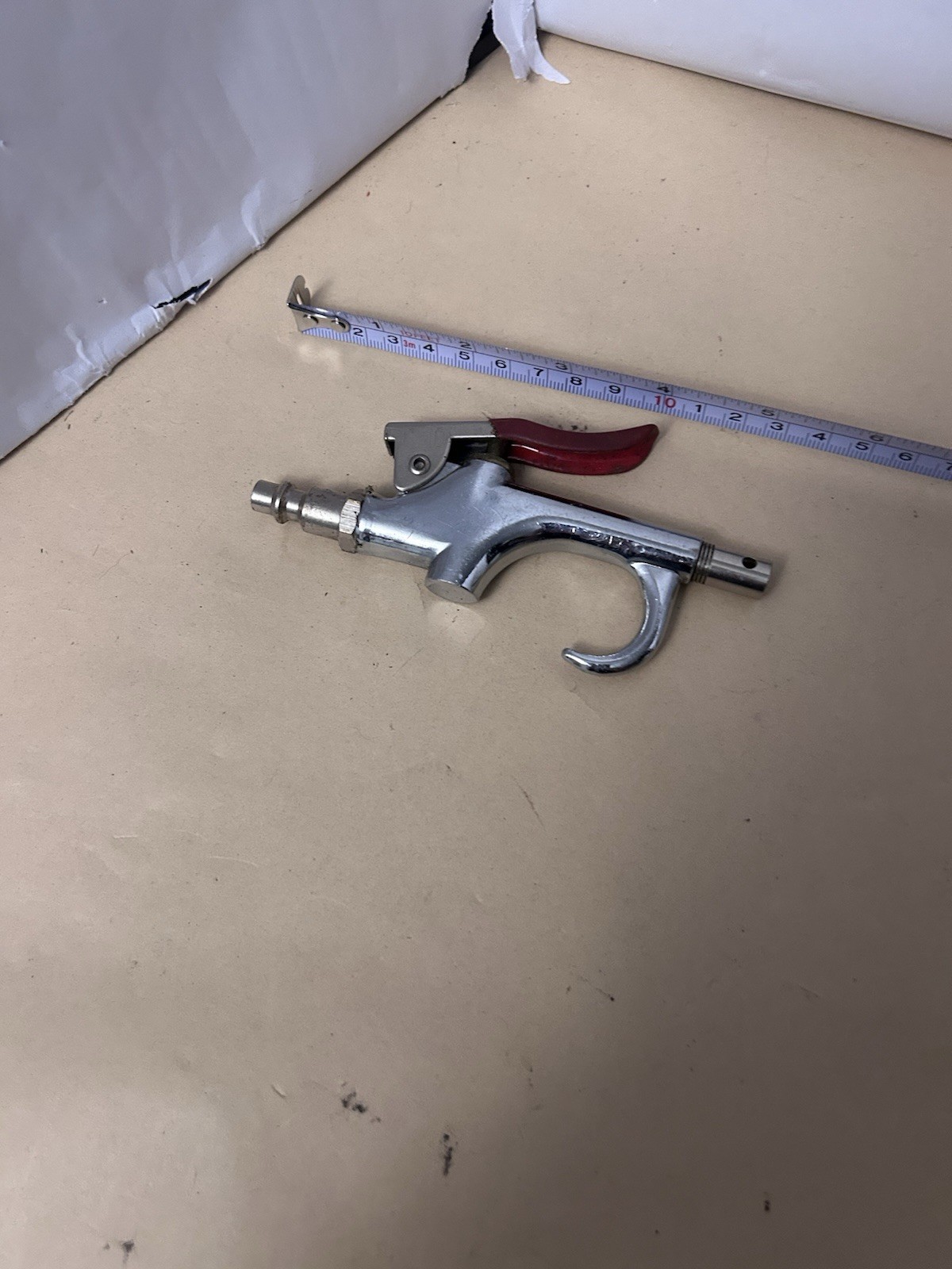 Unbranded untested pneumatic air gun with red handle