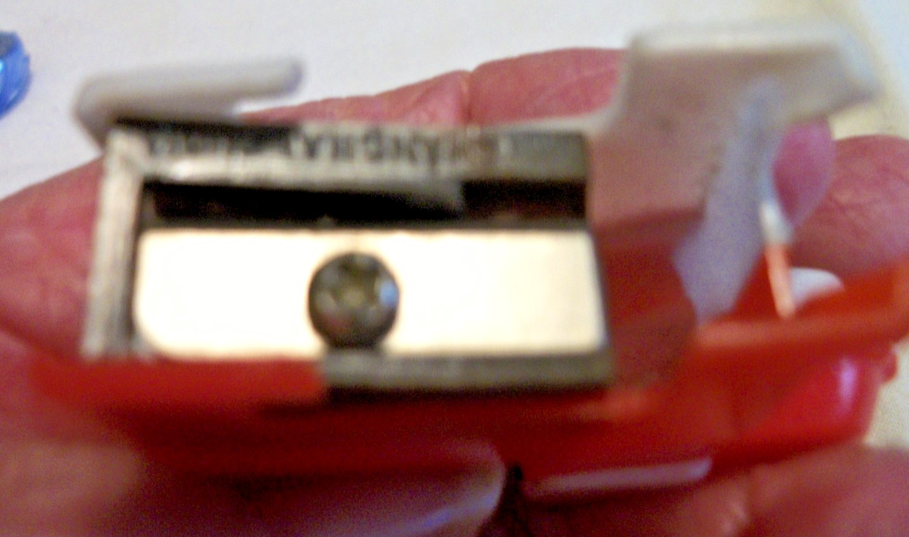 TINY FIGURAL PENCIL SHARPENER RED AND WHITE DOG