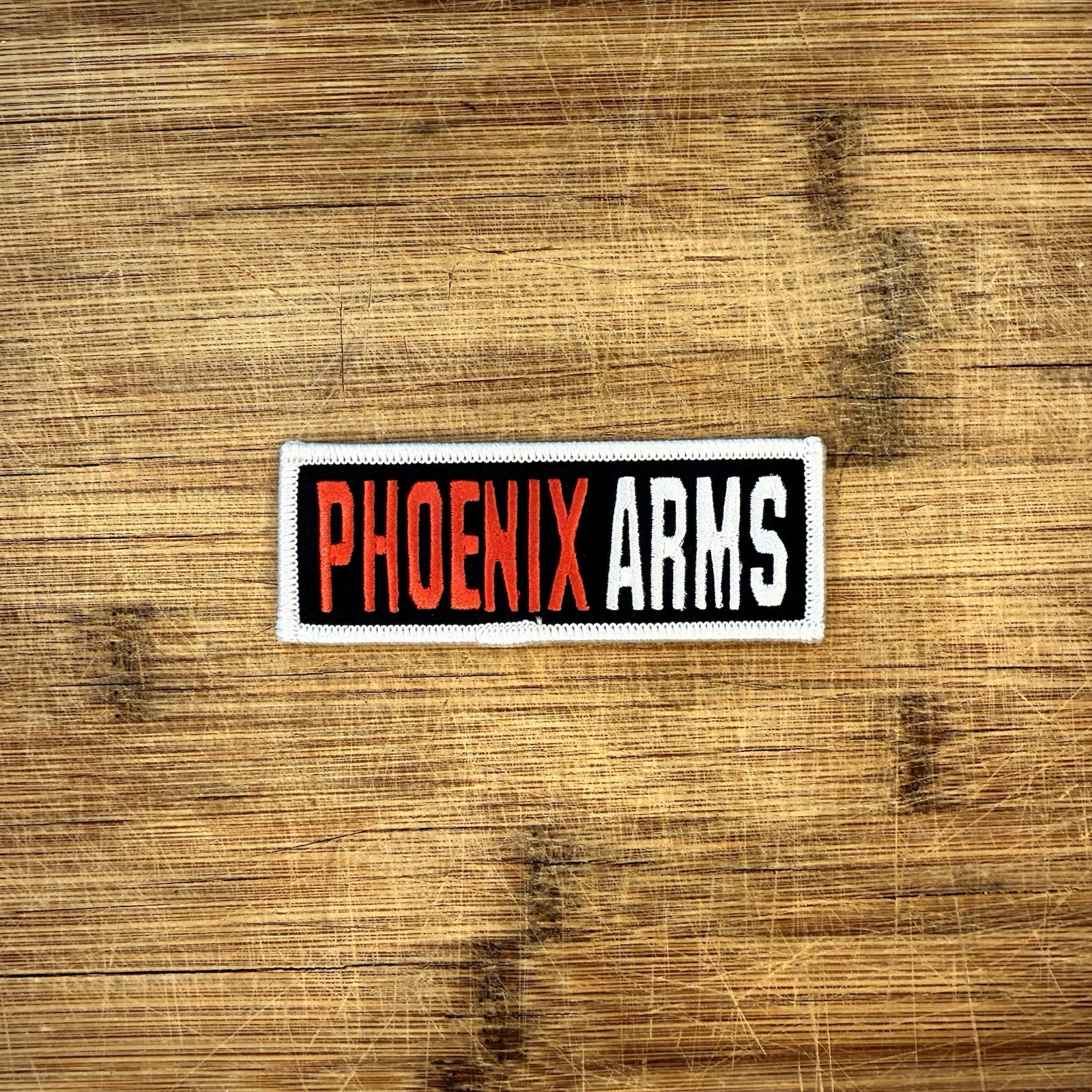 Phoenix Arms Patch 4x1.5in Embroidered Logo Black White Orange Sew On