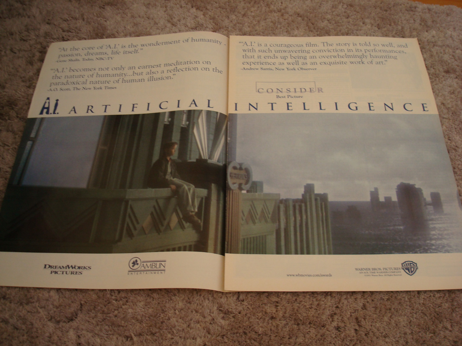 A.I. ARTIFICIAL INTELLIGENCE Oscar ad Haley Joel Osment on ledge, Spielberg