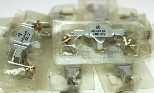 (10)  New  Allen Bradley Contacts # 700-C2, sealed individually