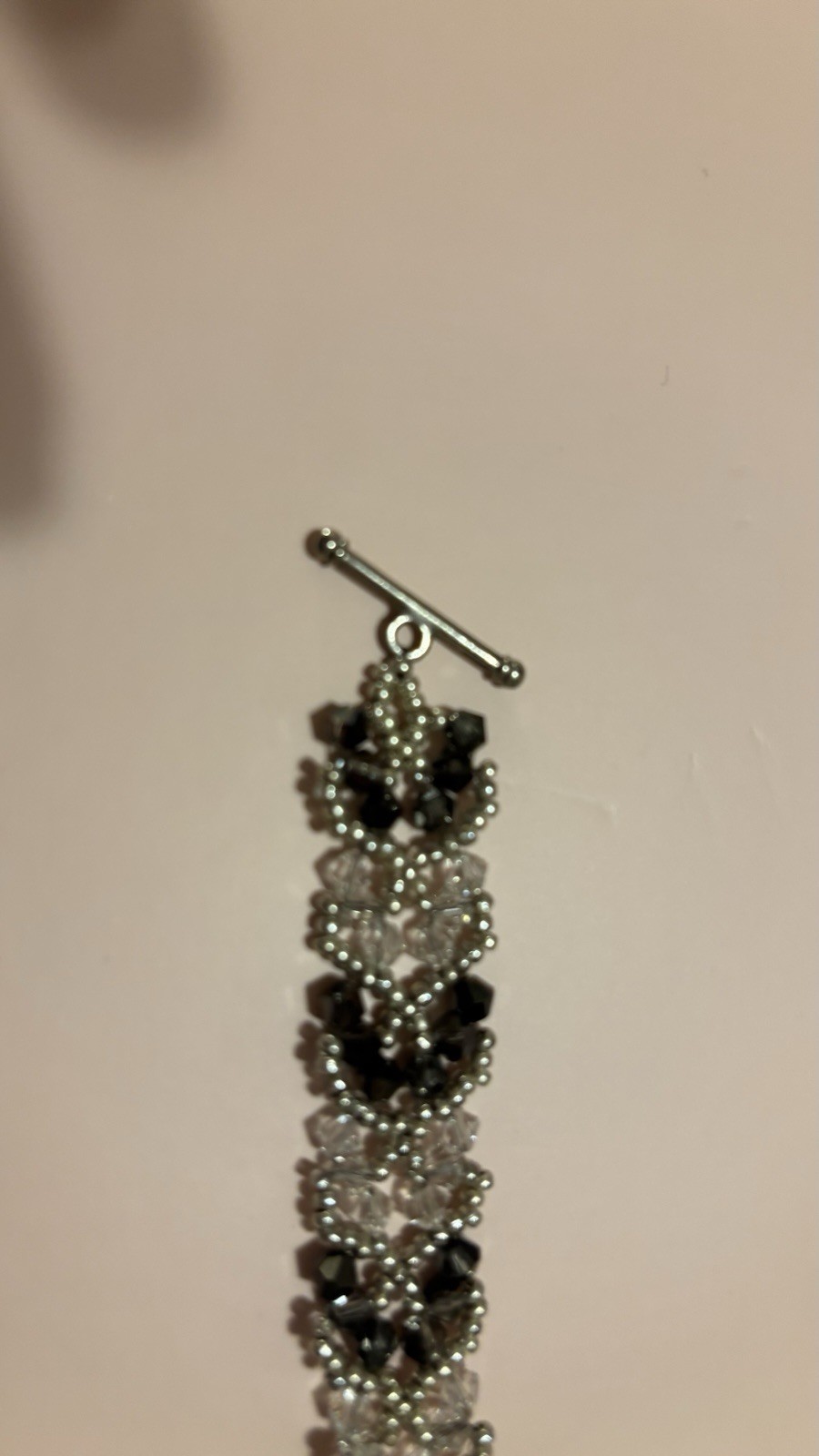 Beaded Bracelet with Black Clear Silver Flower Dangle Charm Toggle Closure