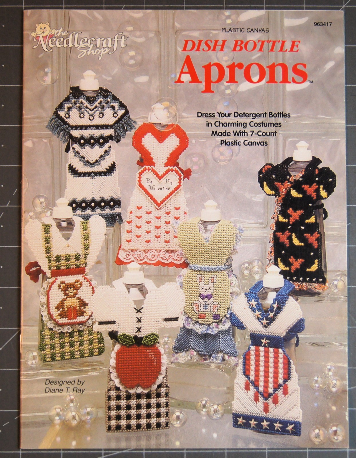 Dish Bottle Aprons Plastic Canvas Booklet by The Needlecraft Shop