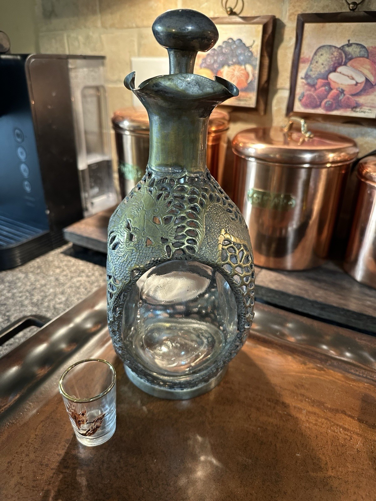 Antique dimple Haig? decanter with dragon decoration SP over Brass.
