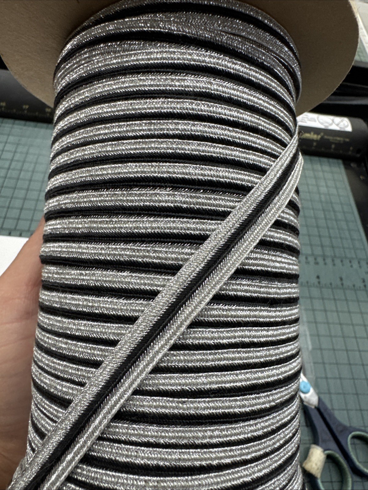Rice Braid - 3/8” Metallic Silver With Black Center Stripe Braid. 110 Yards.