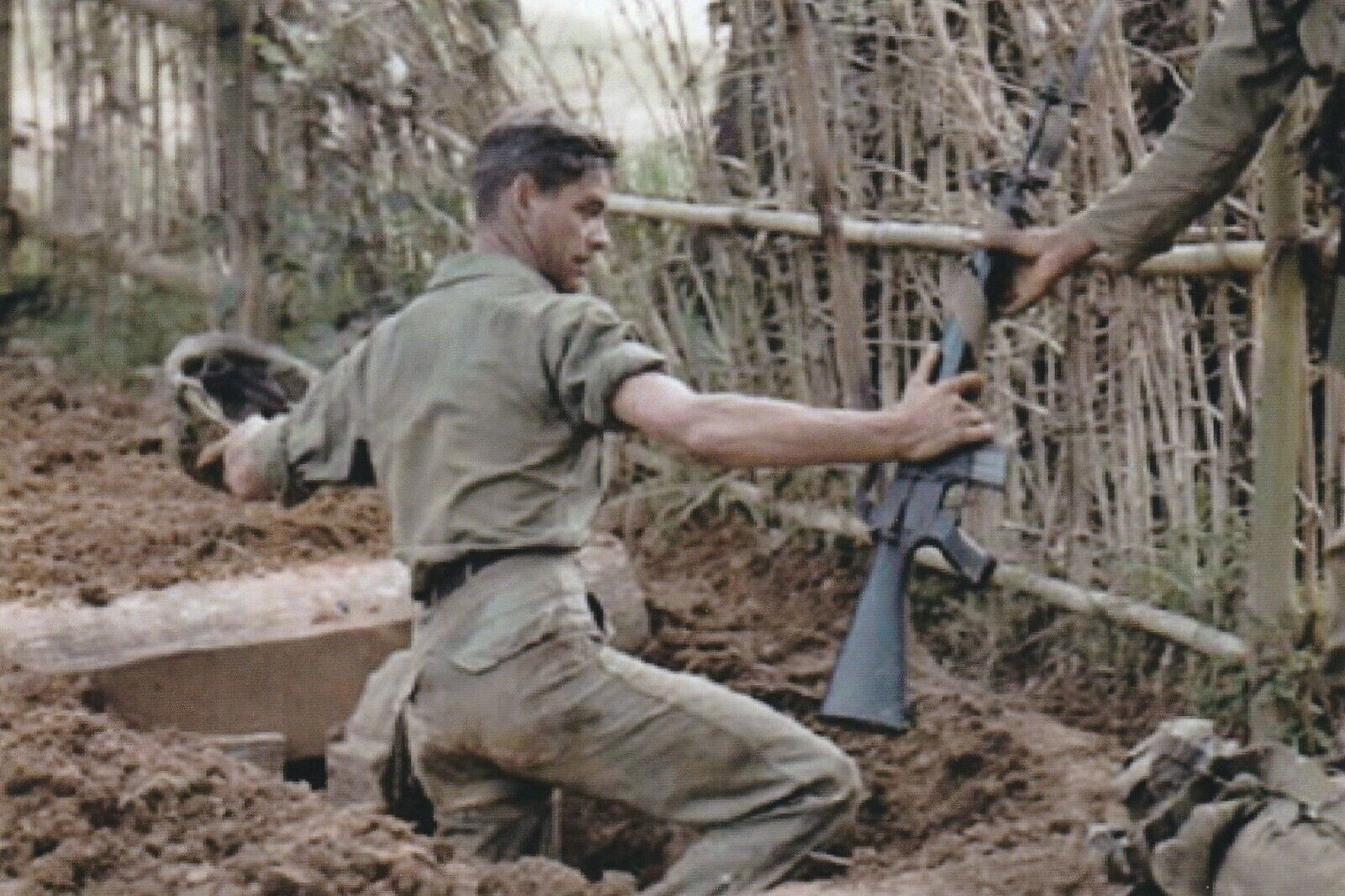 Vietnam  War  Photos -- Soldier Entering VC Tunnel