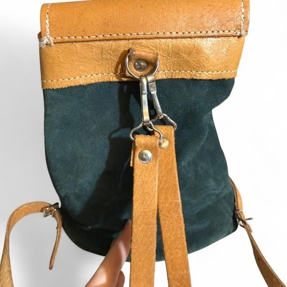 Forest Green Suede and Tan Leather backpack with adjustable straps.