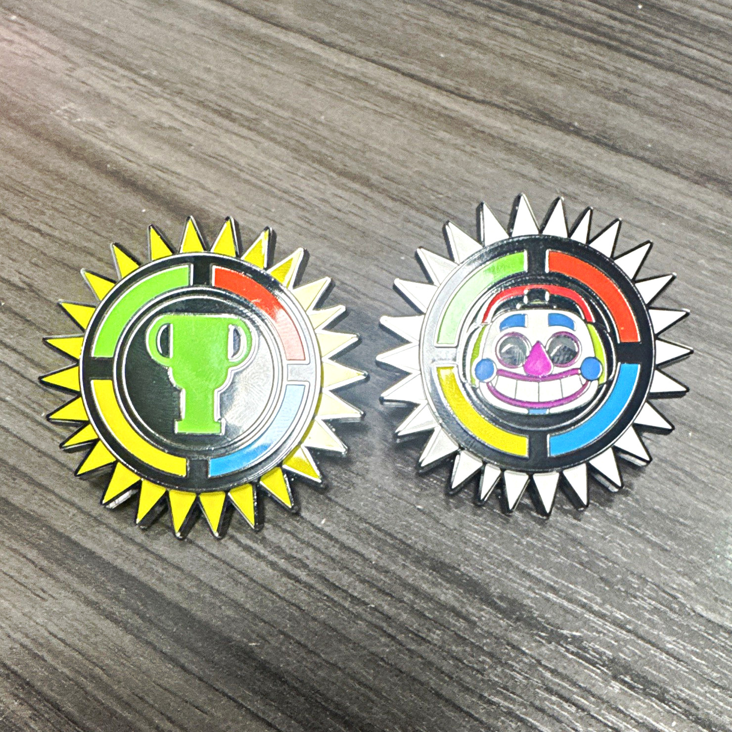 FNAF Pin Set of 2 Multicolor Sunburst Trophy Icon & Clown Face