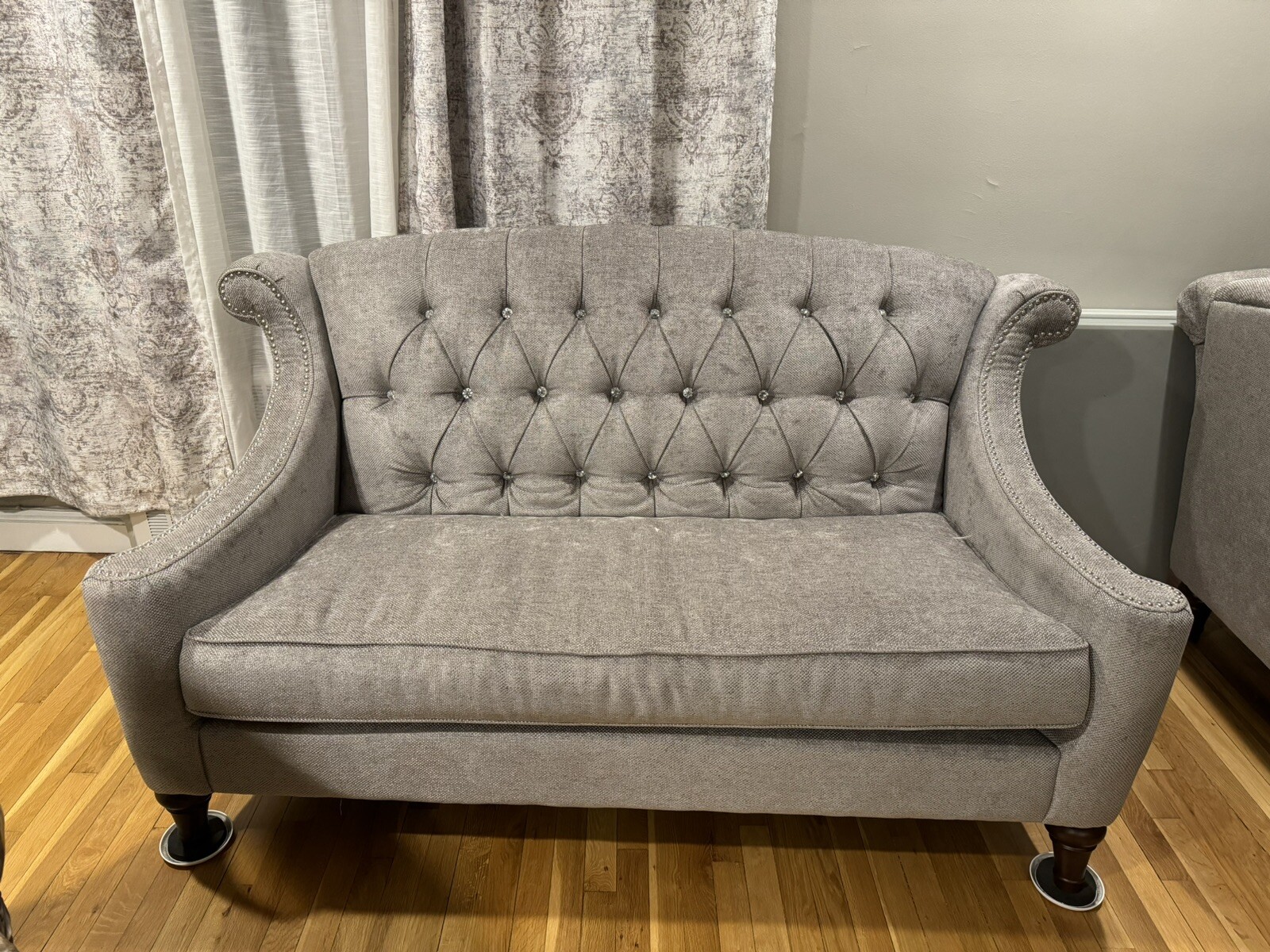 Light grey sofas/ couches.