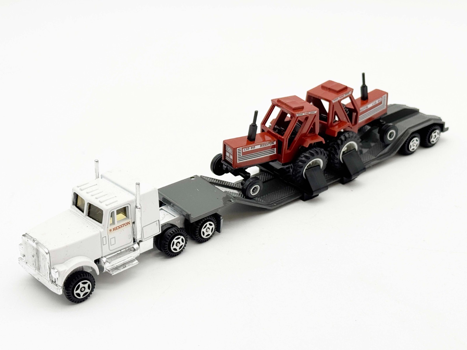 1/64 Hesston Semi W/ Flatbed & Two Hesston 130-90 Tractors