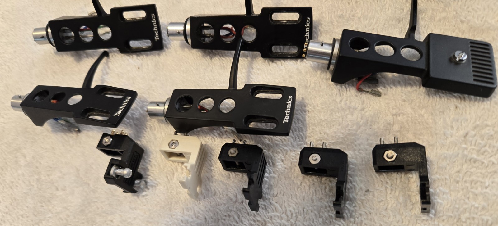 13 Turntable Headshells. 12 OEM Technics, One Pickering. Five P-Mount Adapters