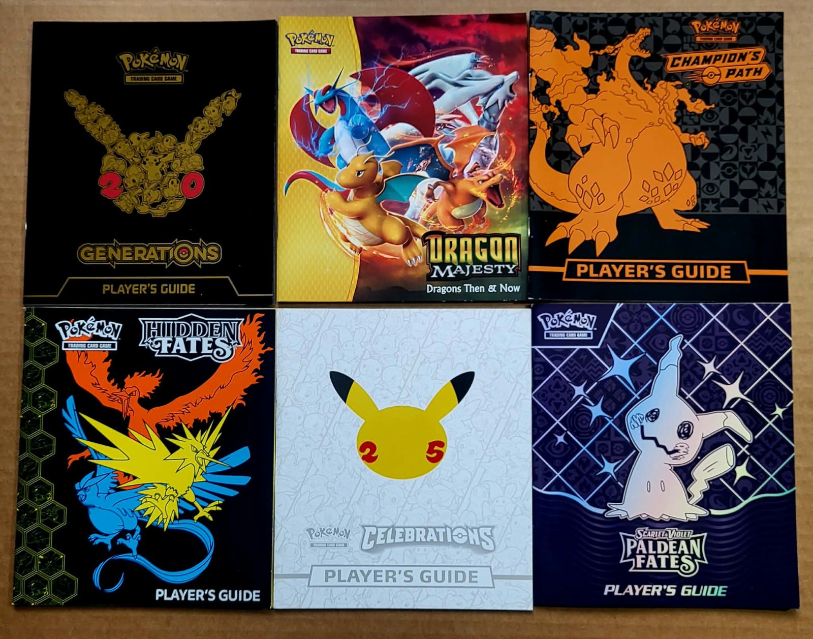 Lot of 6: Pokemon Player's Guide Celebrations Paldean Hidden Fates Generations