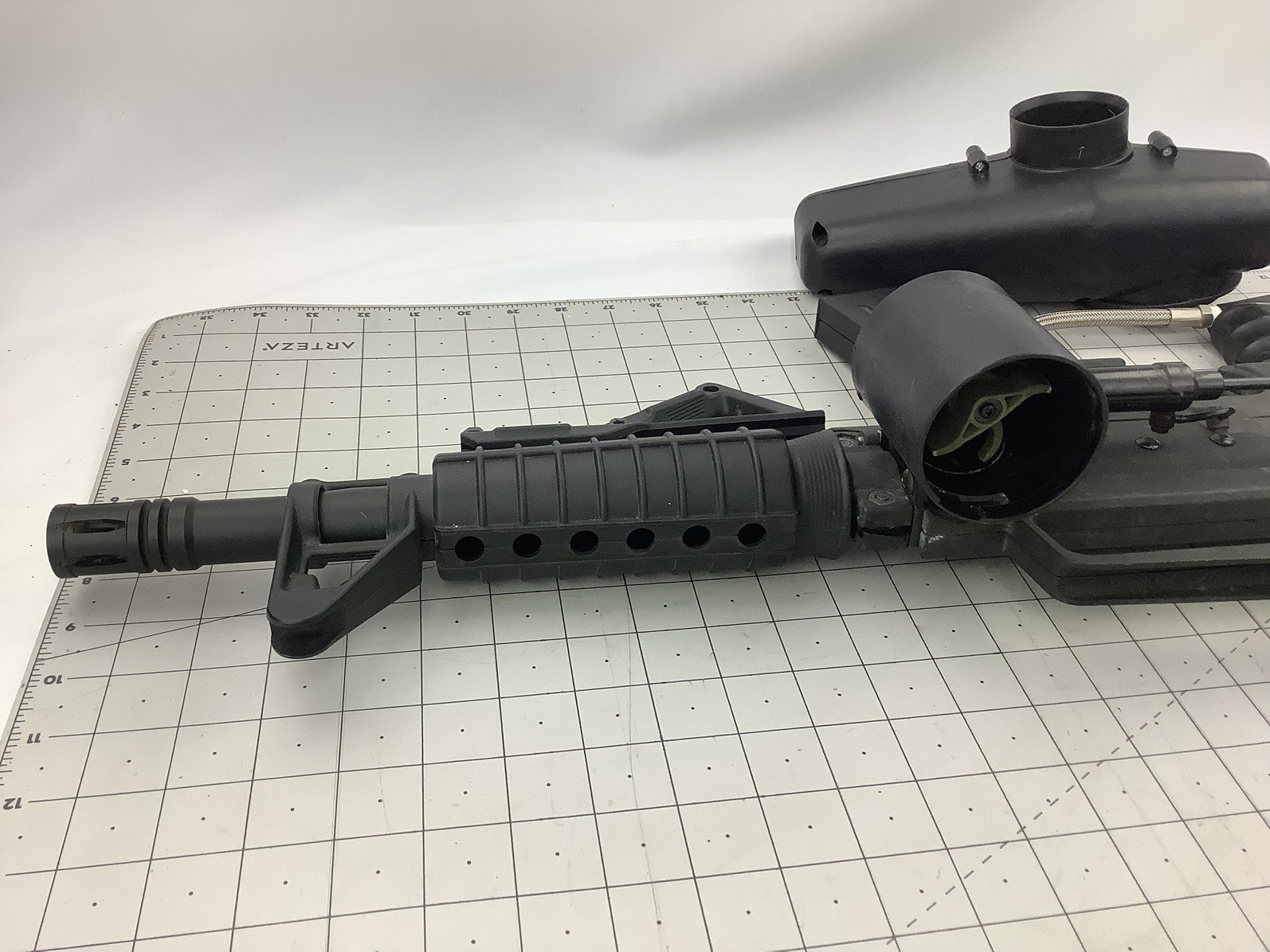 Tippmann Alpha black paintball marker with e trigger and cyclone feed untested