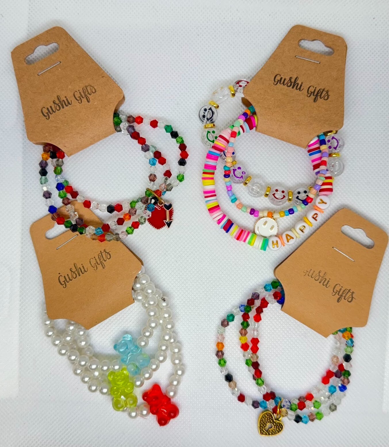 4 Sets of Handmade Beaded Bracelets with Charms