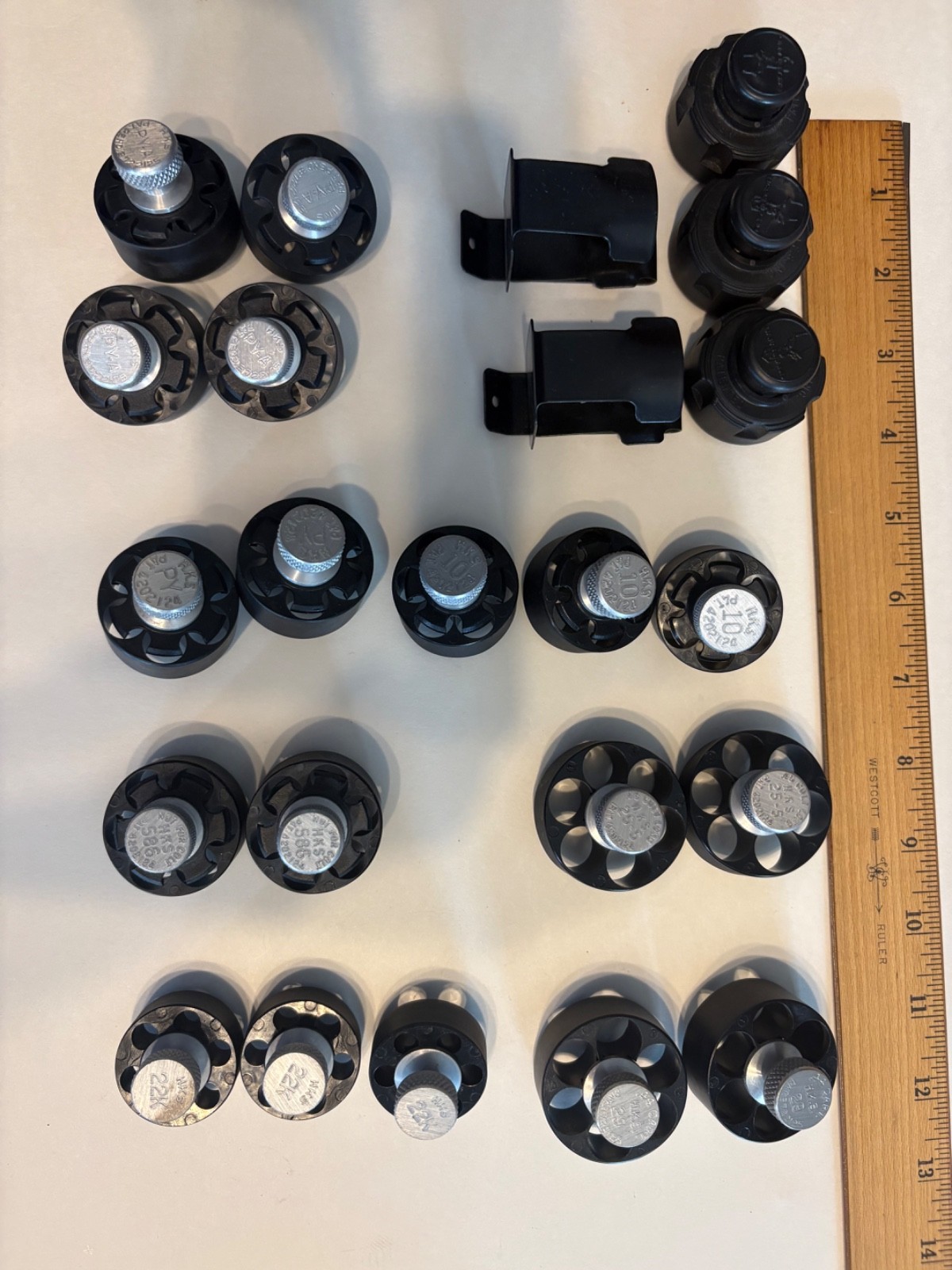 Grab bag of 21 HKS and Safariland speed loaders with two belt clip holders