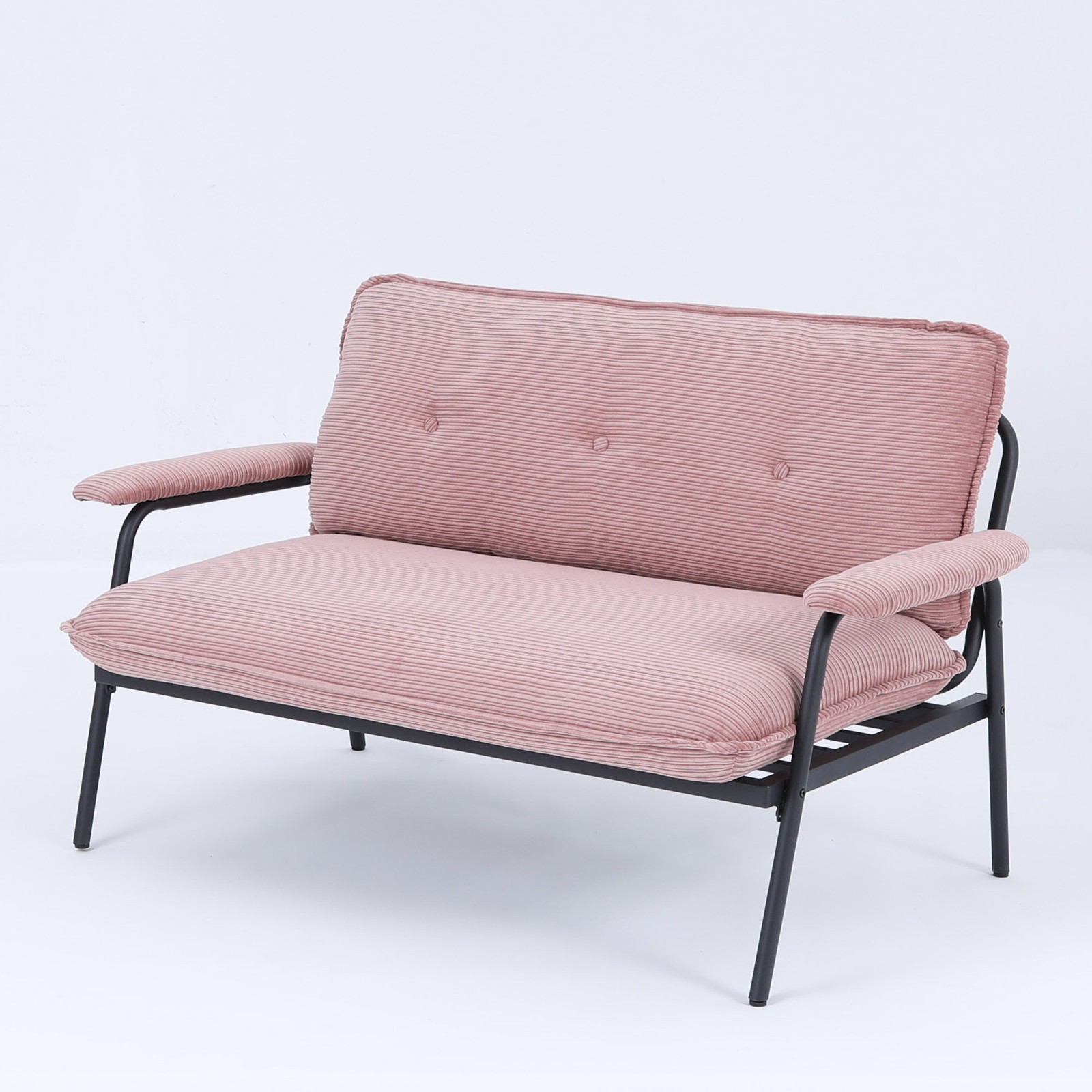 The 53-inch pink sofa offers a spacious layout in the small apartment, easily